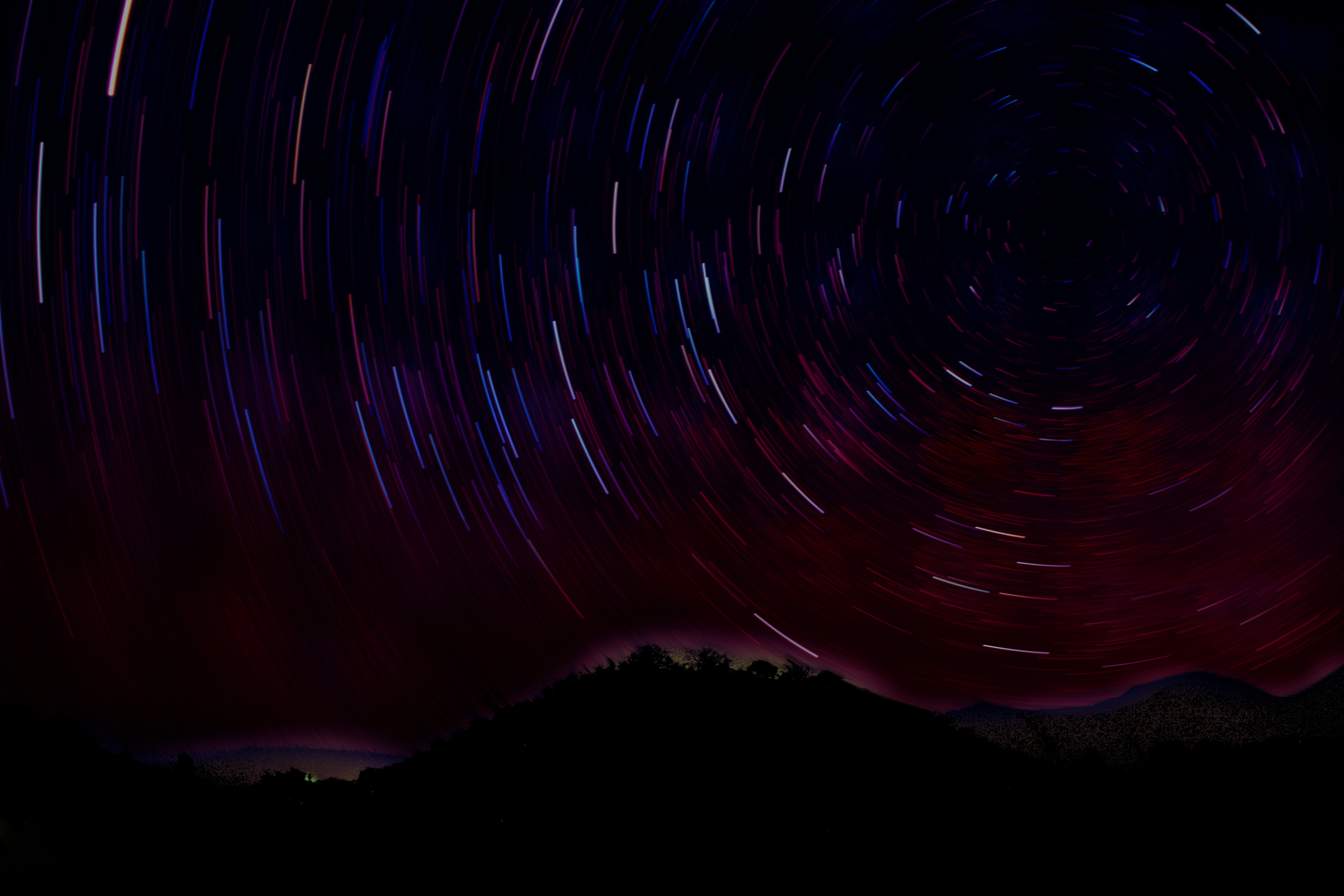 Night Sky Star Trails Over Hills
