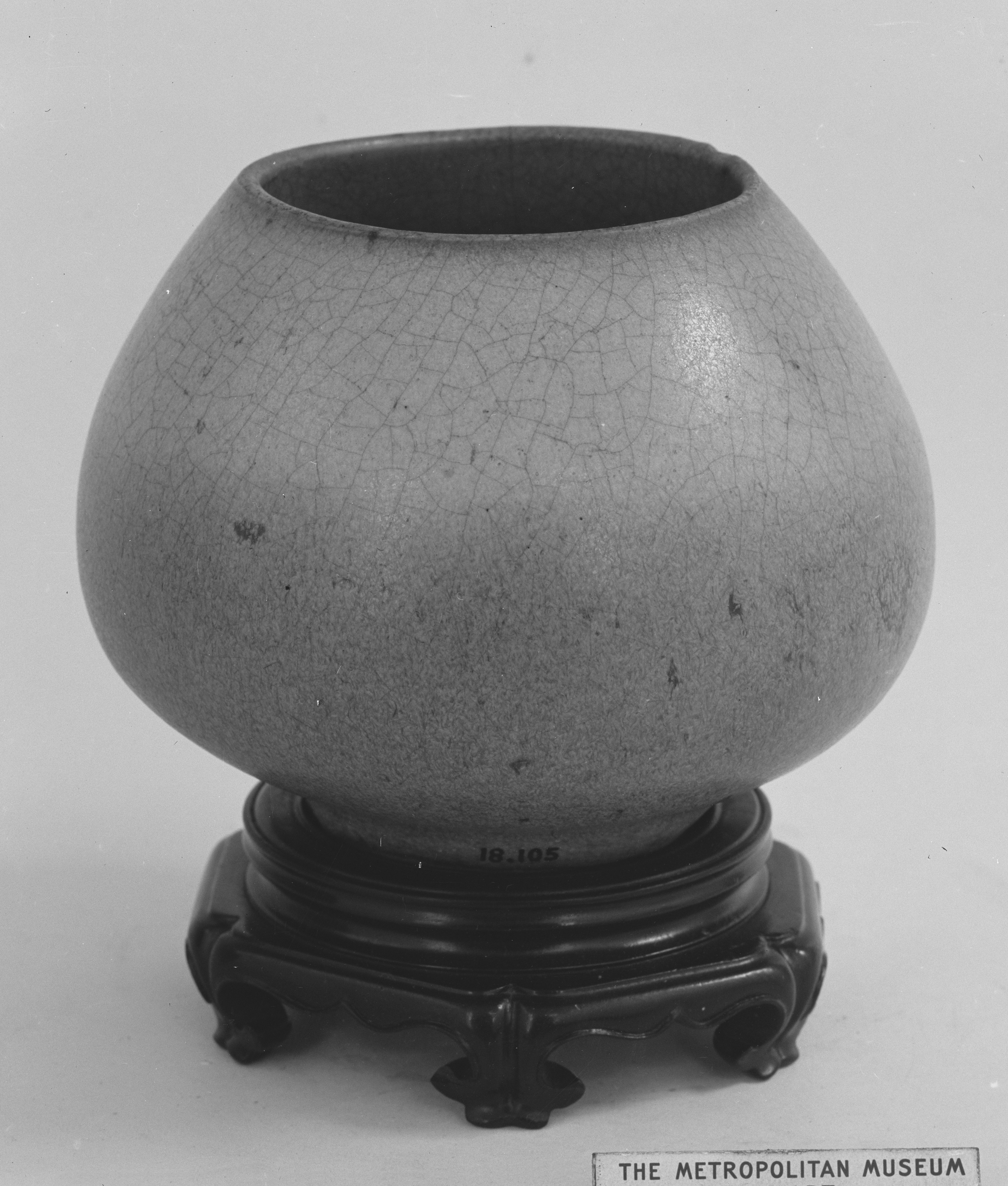 Glazed Ceramic Jar on Wooden Stand