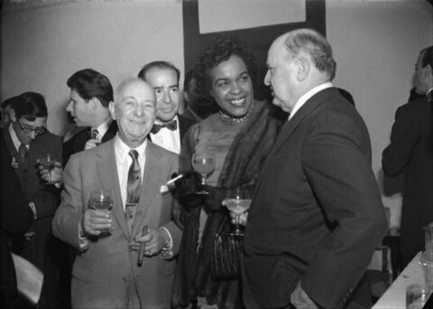 Formally Dressed Guests at Cocktail Gathering