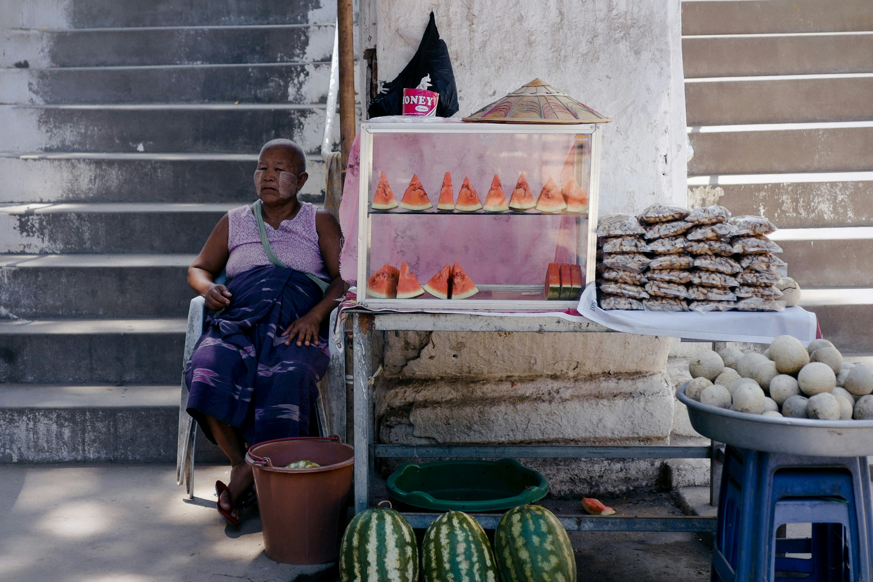 Elderly Vendor's Watermelon Stall