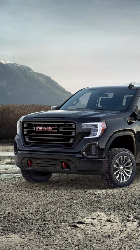 Black GMC Pickup Truck in Mountains