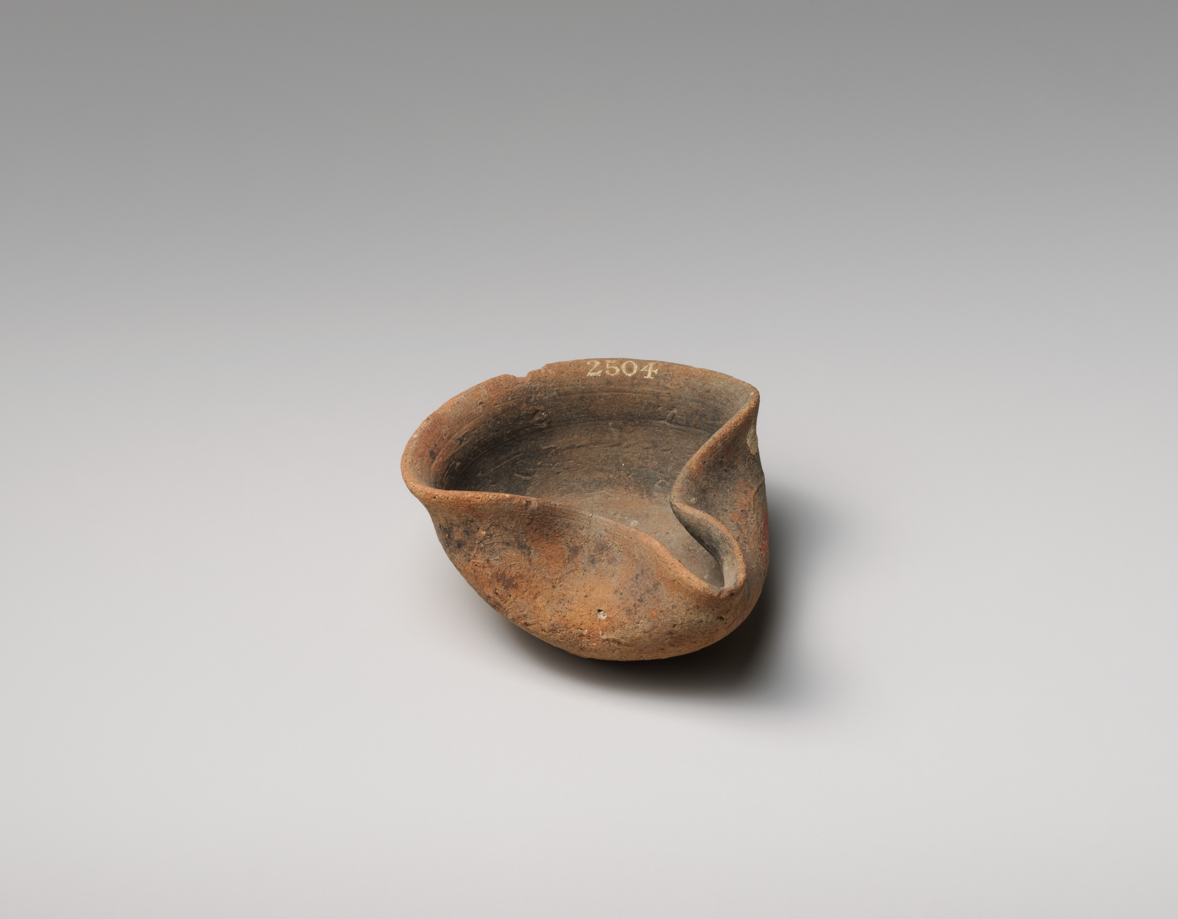 Ancient Earthenware Pouring Bowl