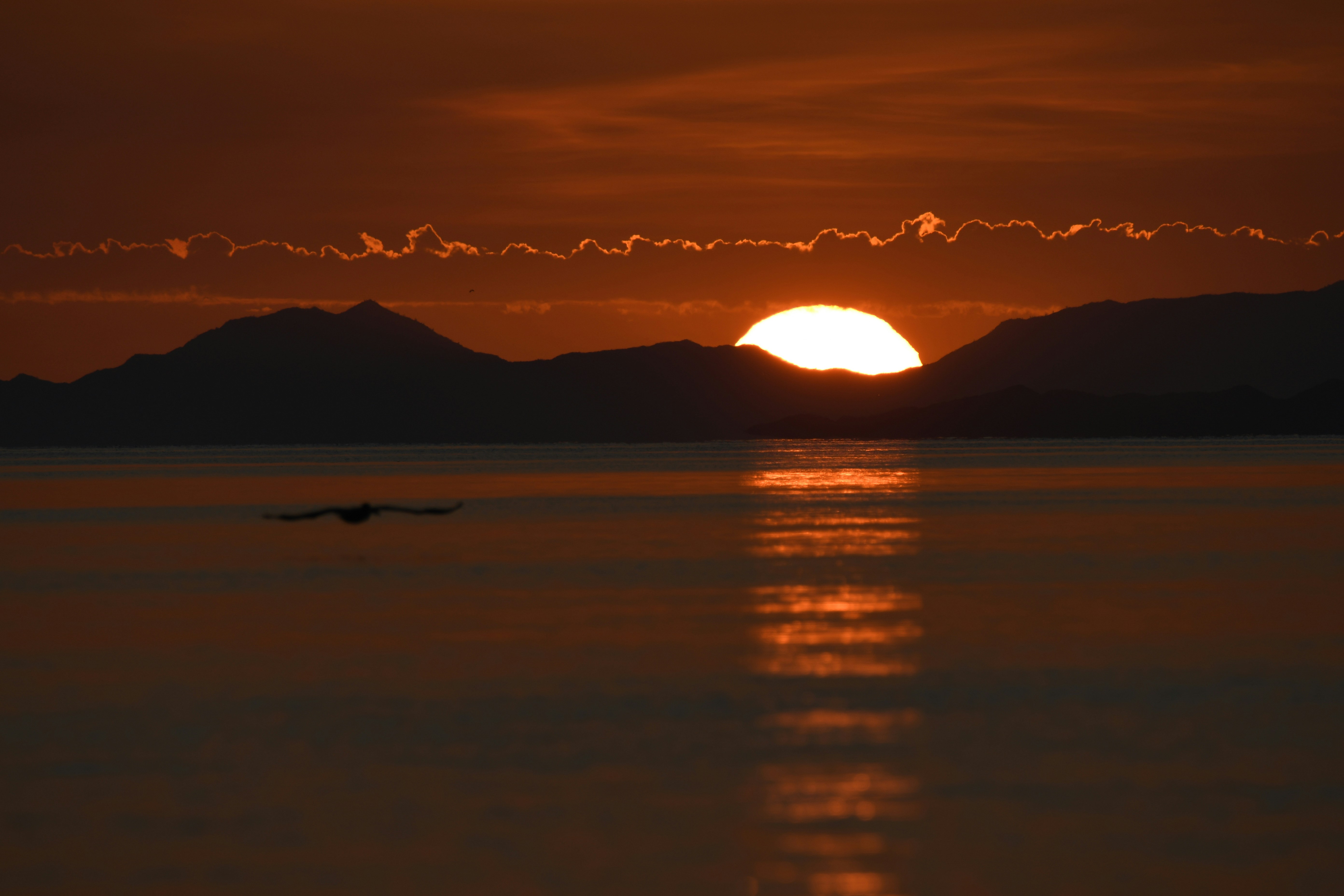 Sunset Over Water and Mountains