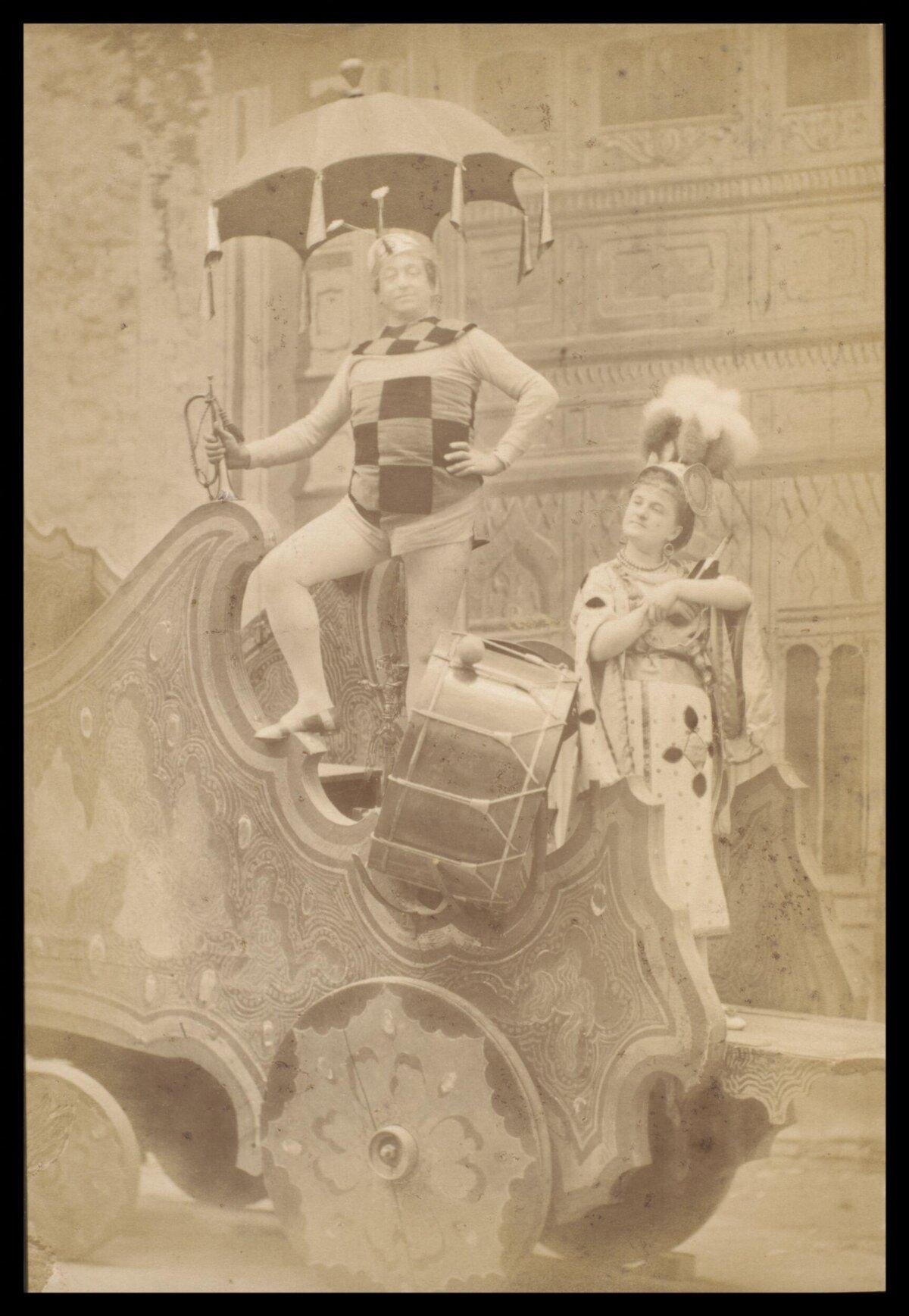 Two Costumed Performers on Ornate Float