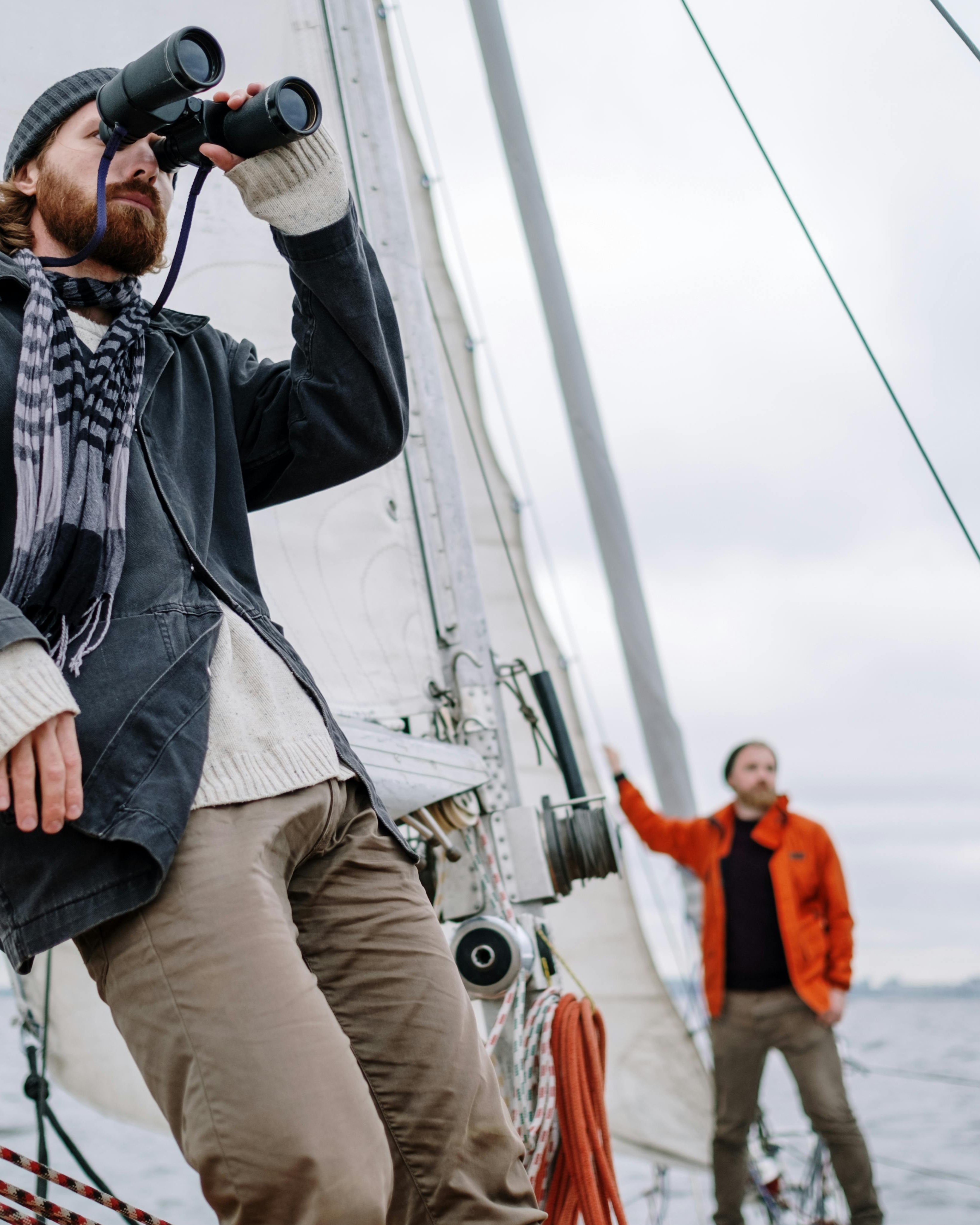 Two Men Sailing on a Sailboat