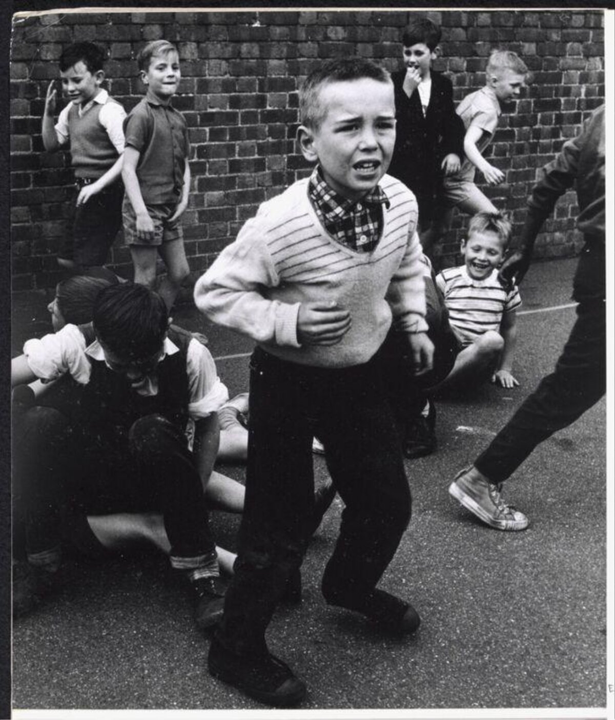 Upset Boy Running on School Playground