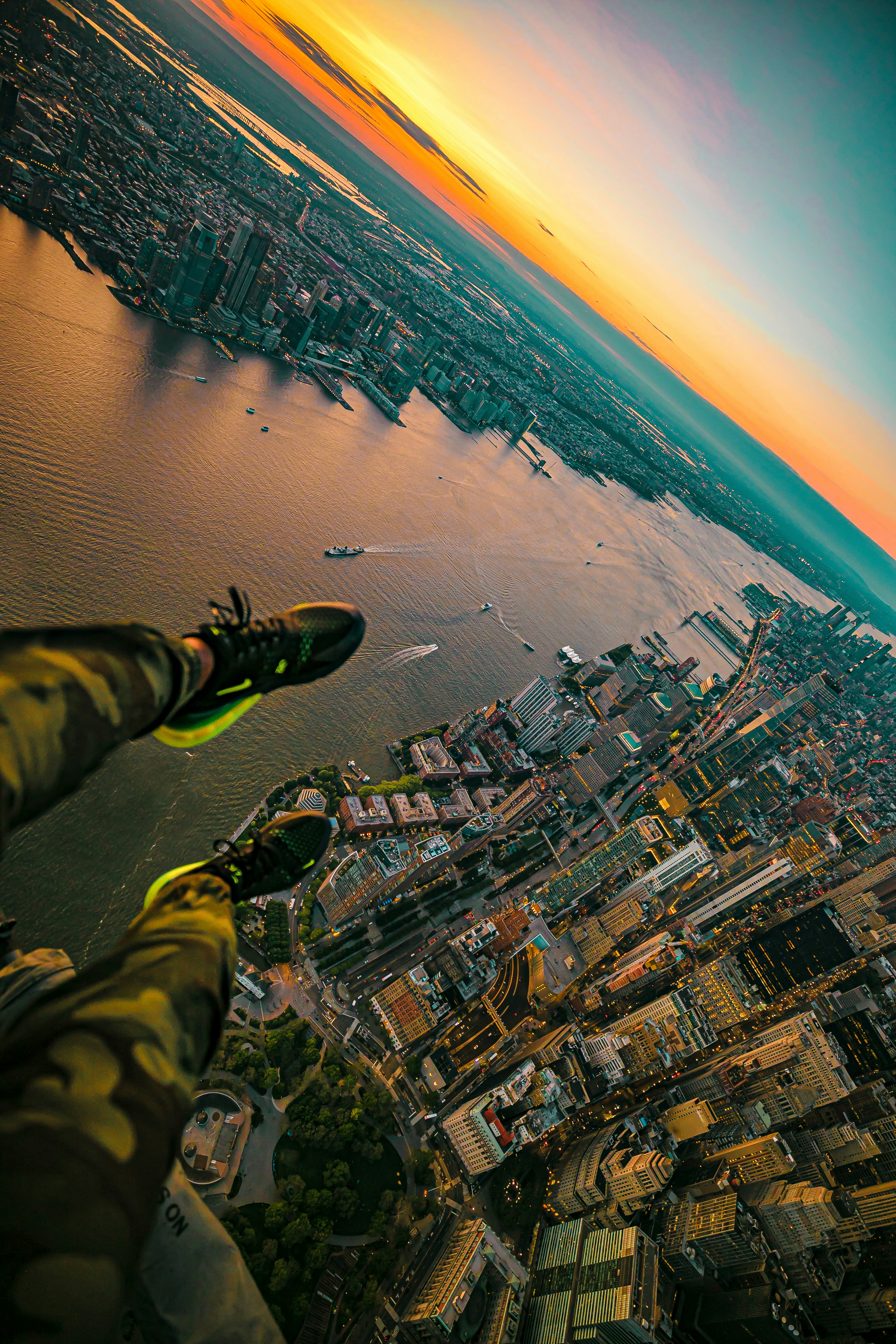 First-Person Aerial City View at Sunset