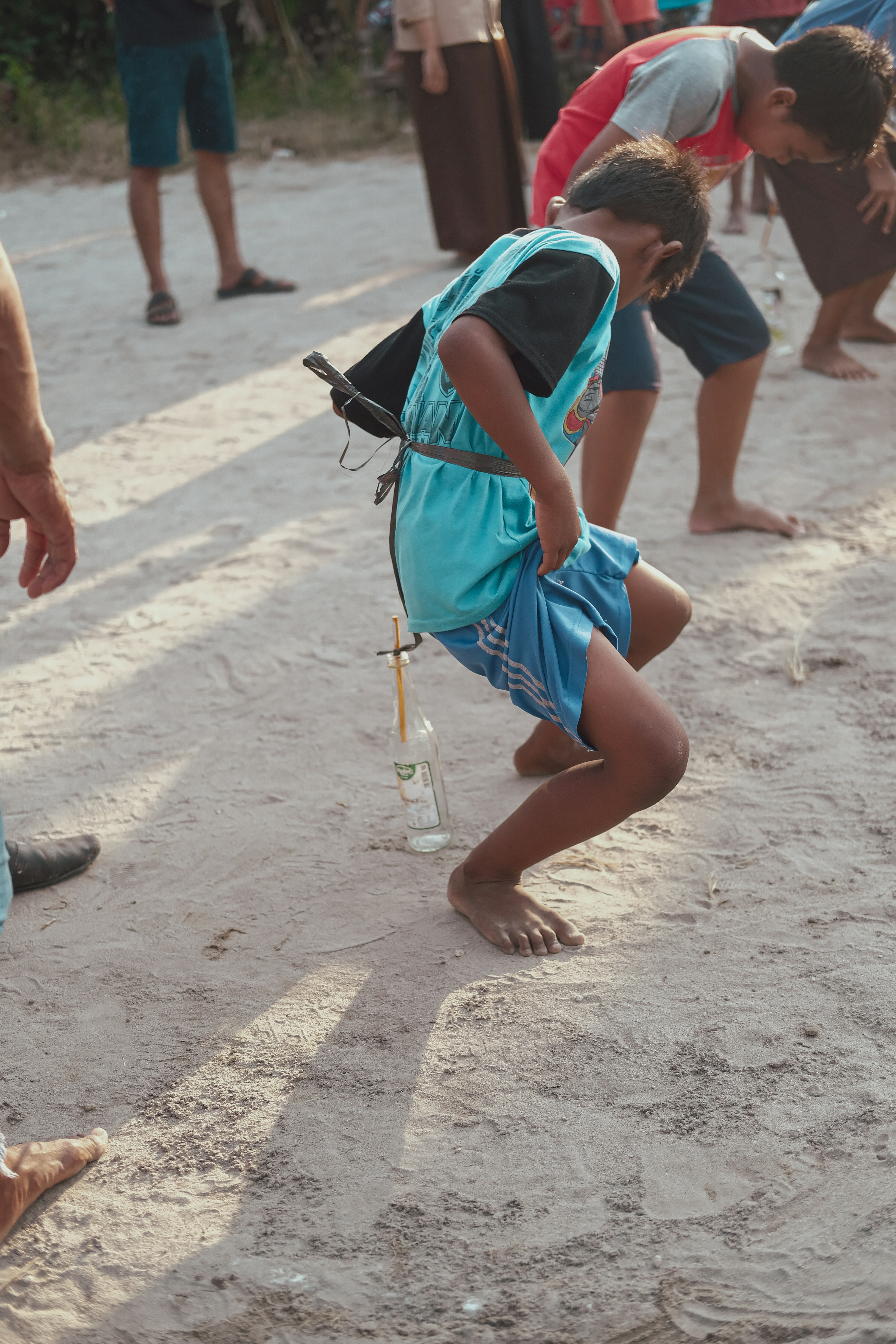 Boys Playing Outdoor Village Game