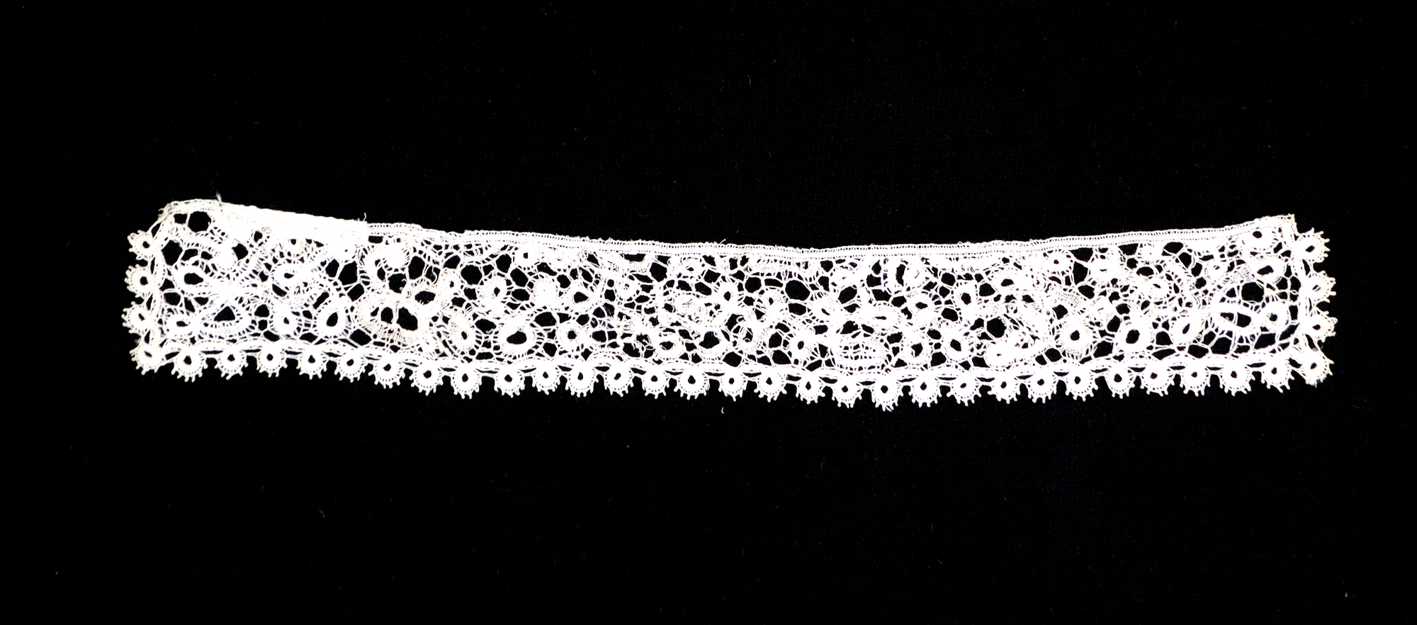 White Lace Trim on Black Background