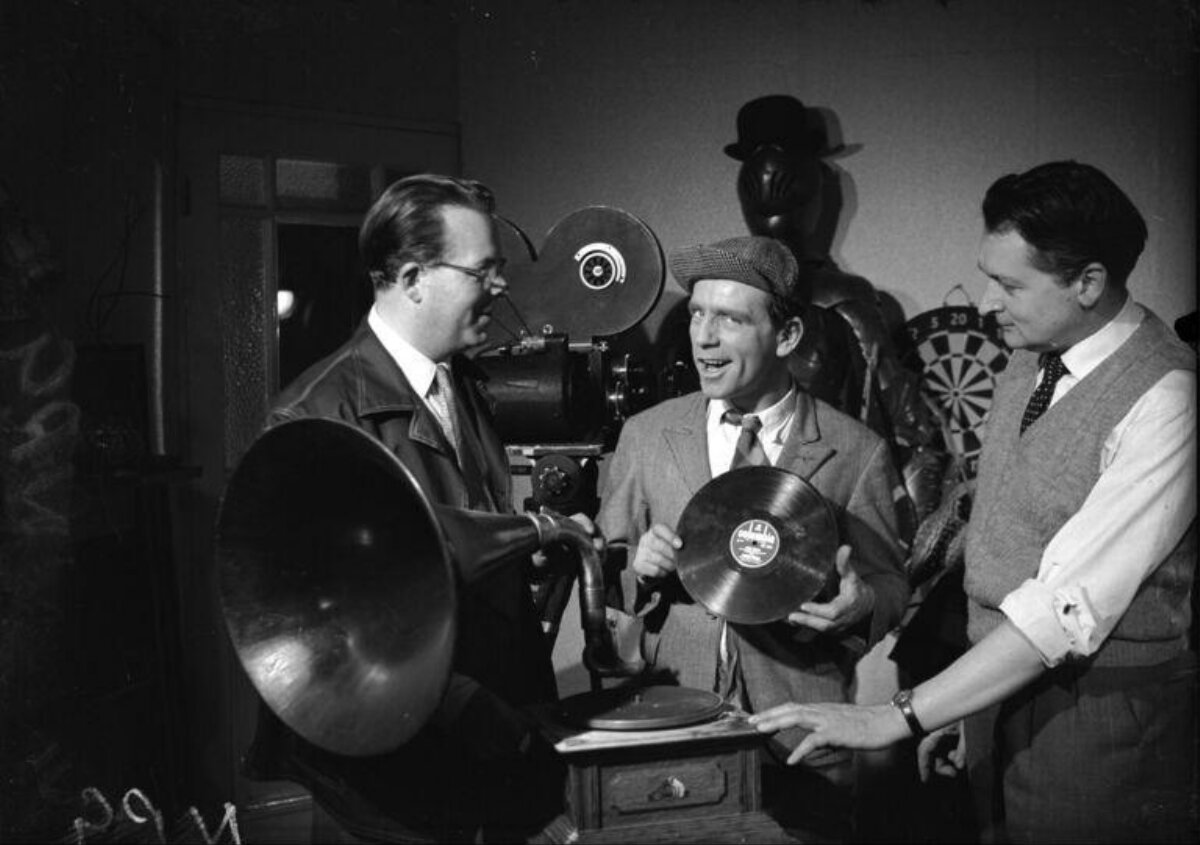 Three Men With Vintage Gramophone And Film Gear