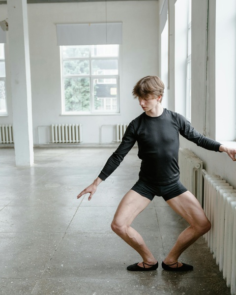 Male Ballet Dancer Practicing in Studio