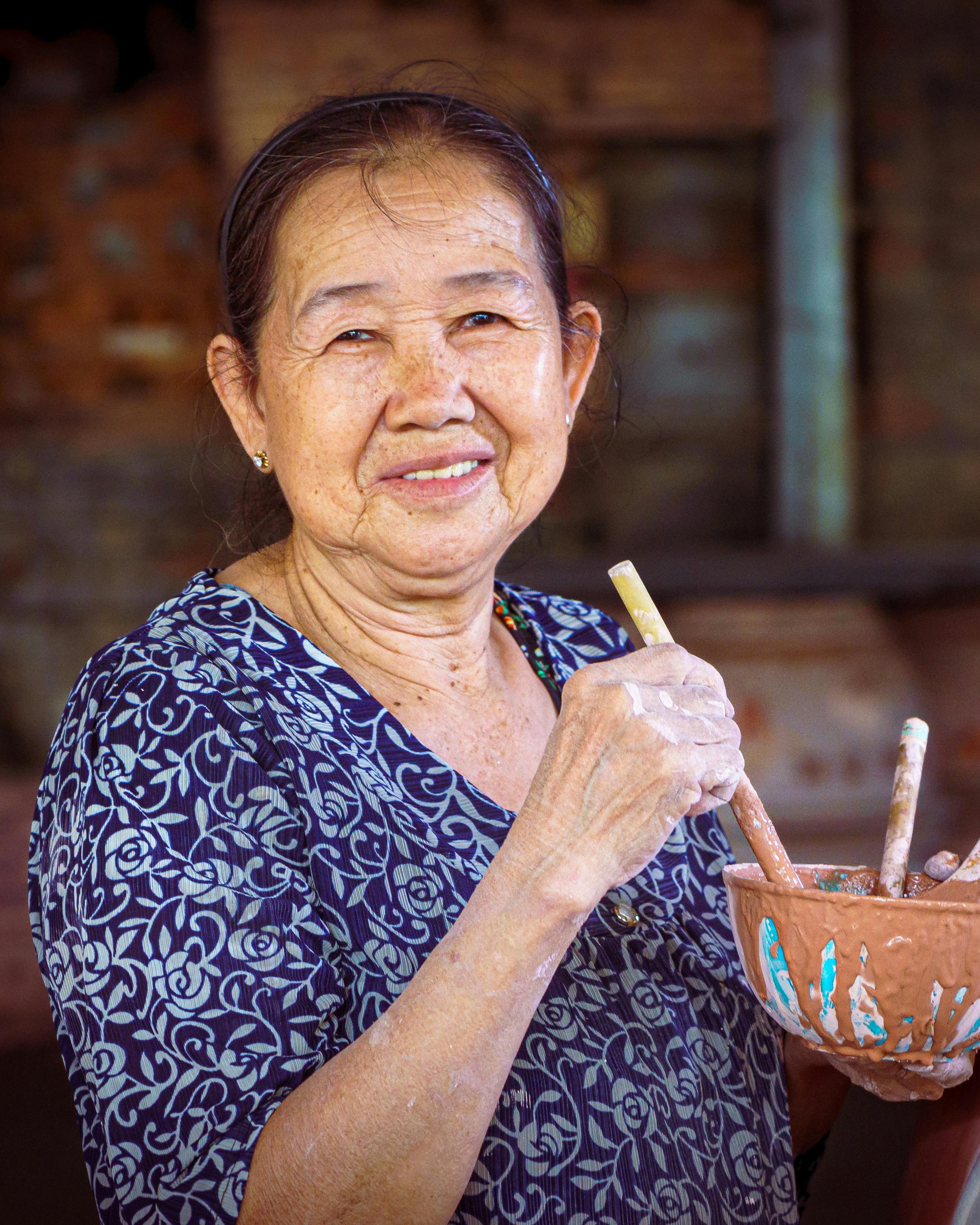 Elderly Female Potter At Work