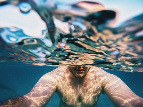 Half-Submerged Man Underwater