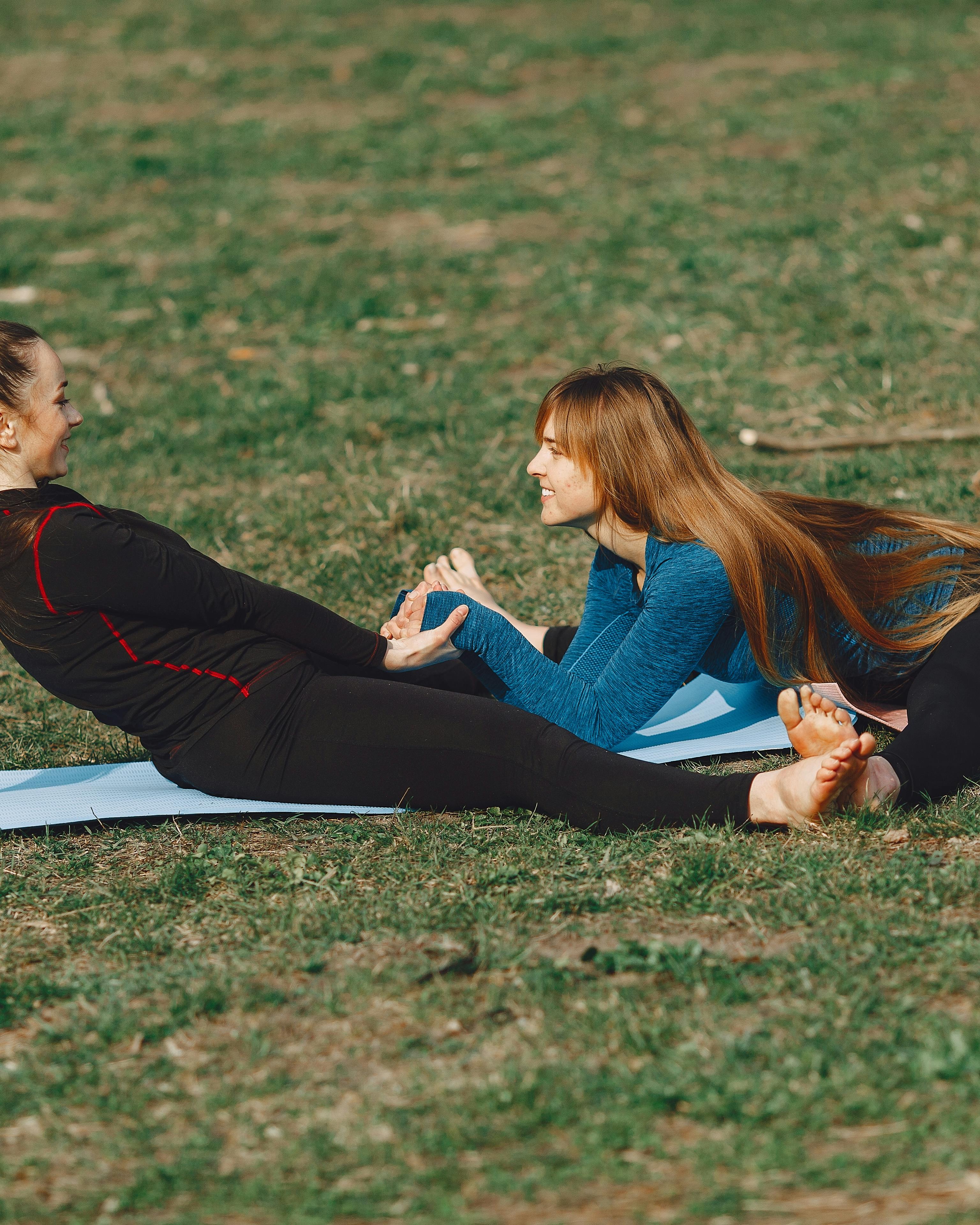Two Women Doing Partner Yoga Outdoors
