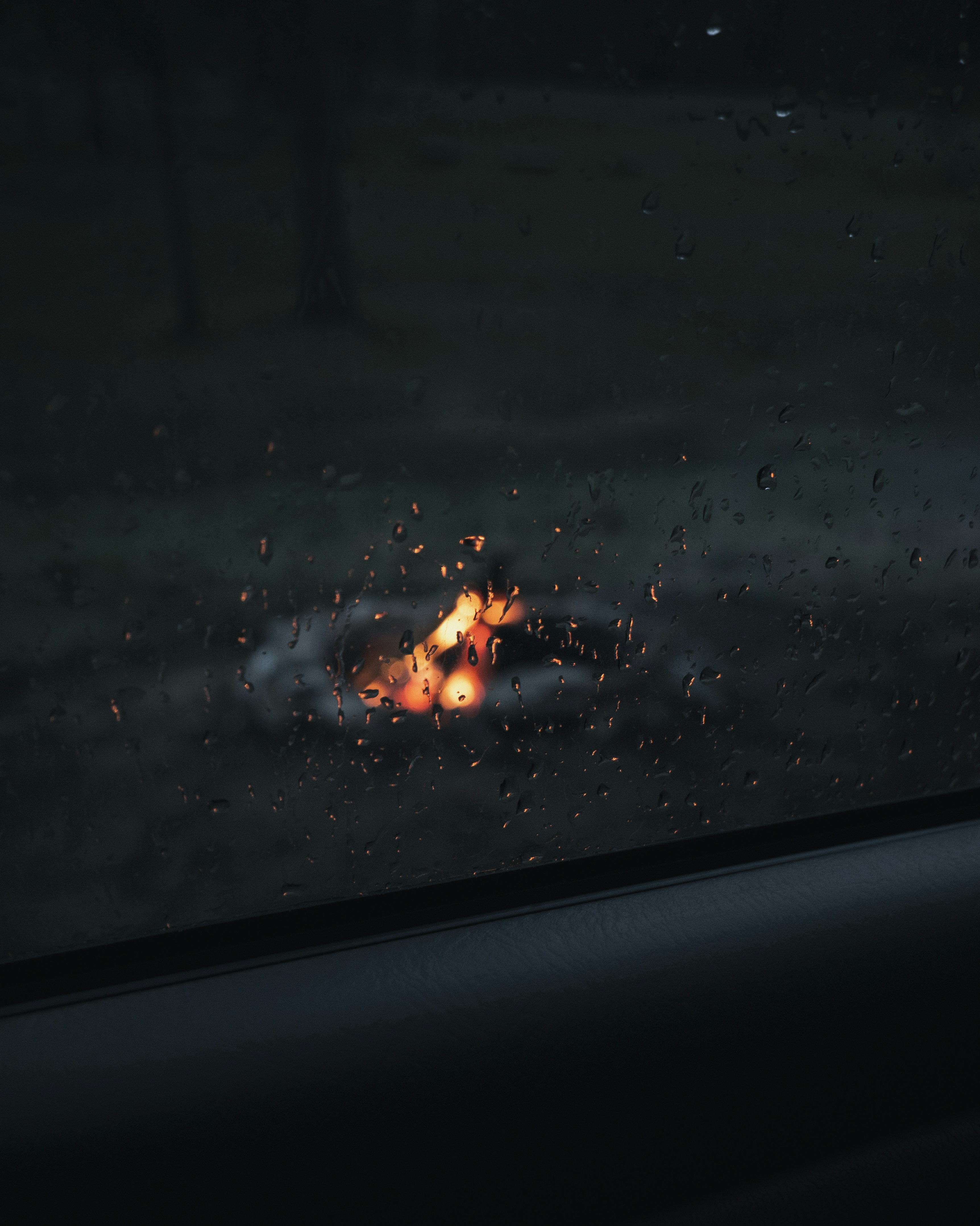 Campfire Through Rainy Car Window