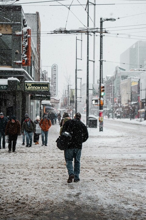 Snowy Urban Street With Pedestrians