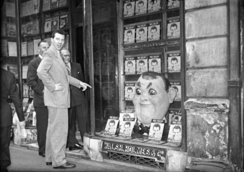 Author Viewing Big Head Book Display
