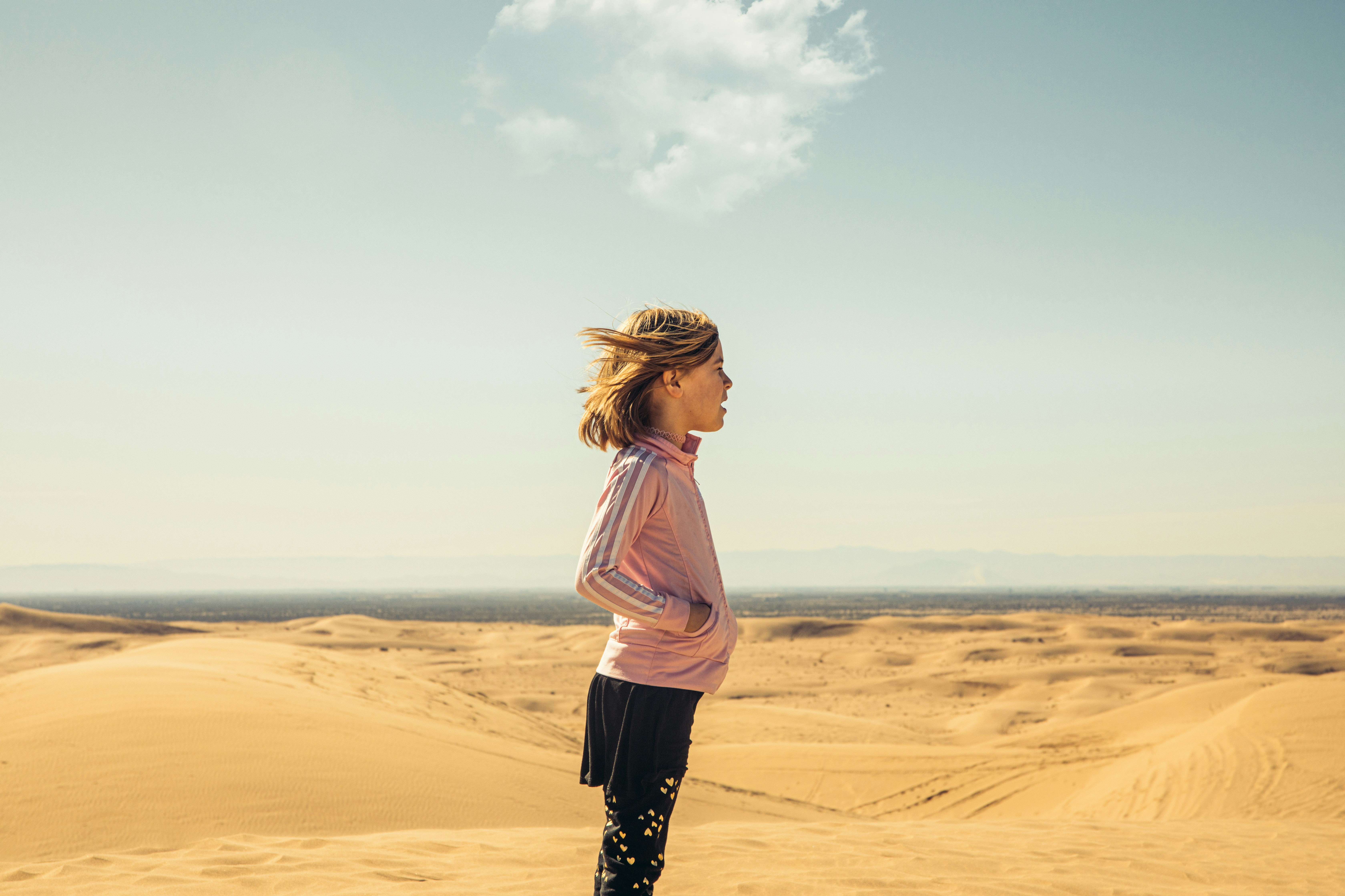 Girl Standing on Sand Dunes