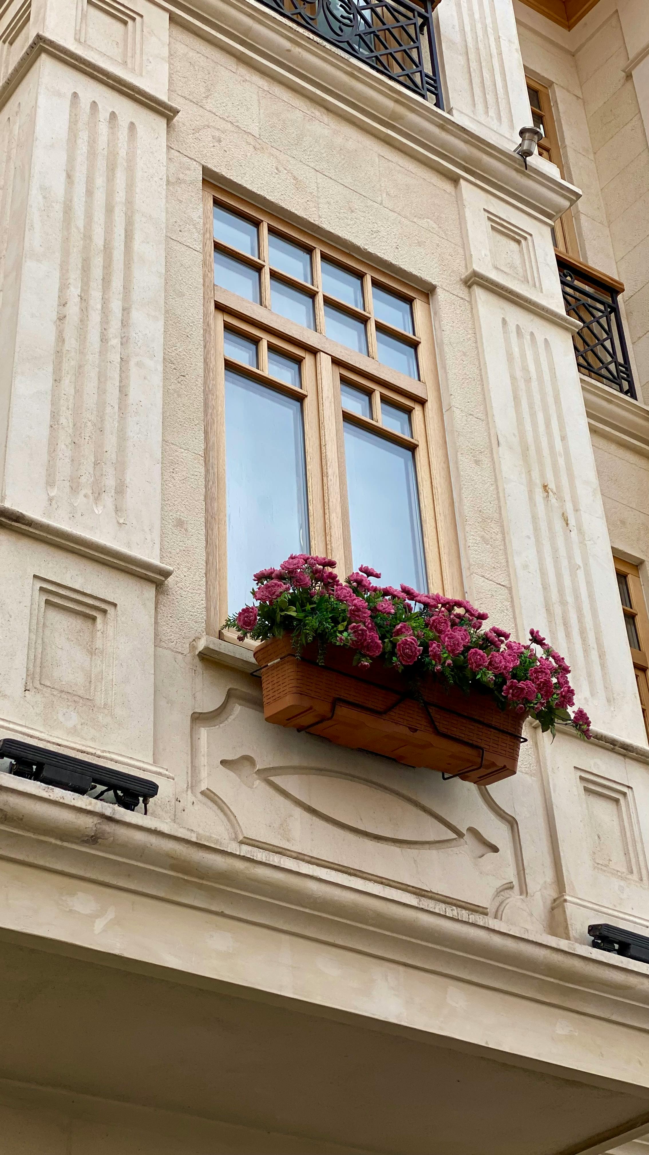 Window Box with Pink Roses on Stone Building