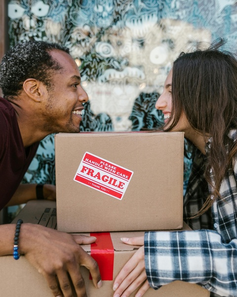 Happy Couple With Moving Boxes