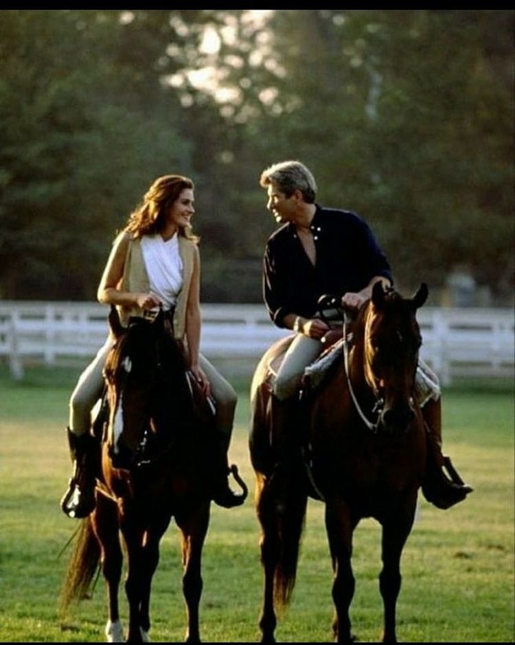 Couple Riding Horses in Pasture