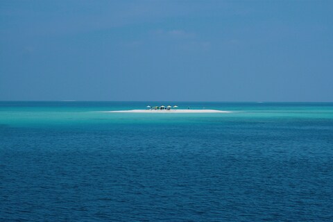 Tiny Sandbar in Blue Ocean