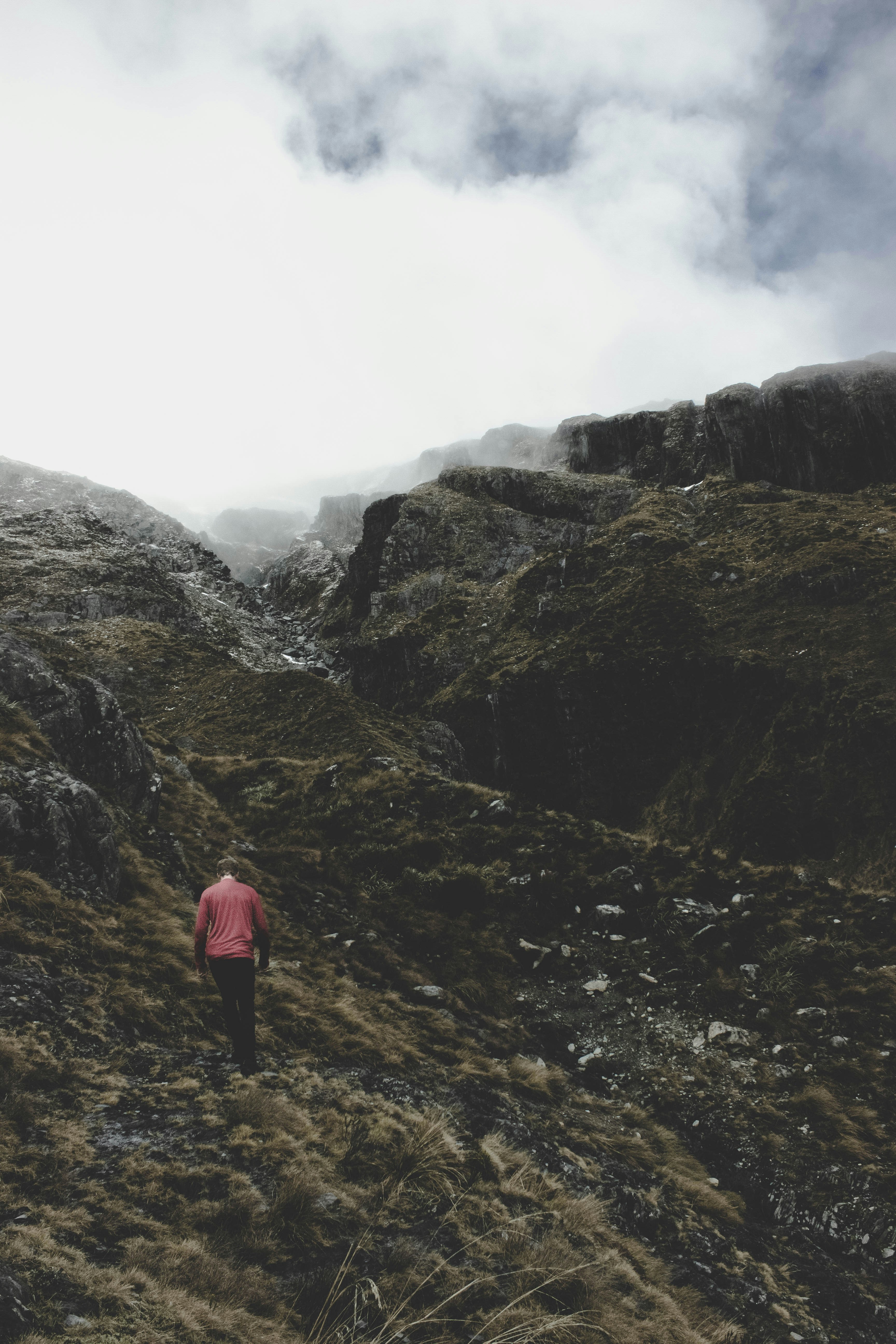 Lone Hiker in Foggy Mountain Gorge