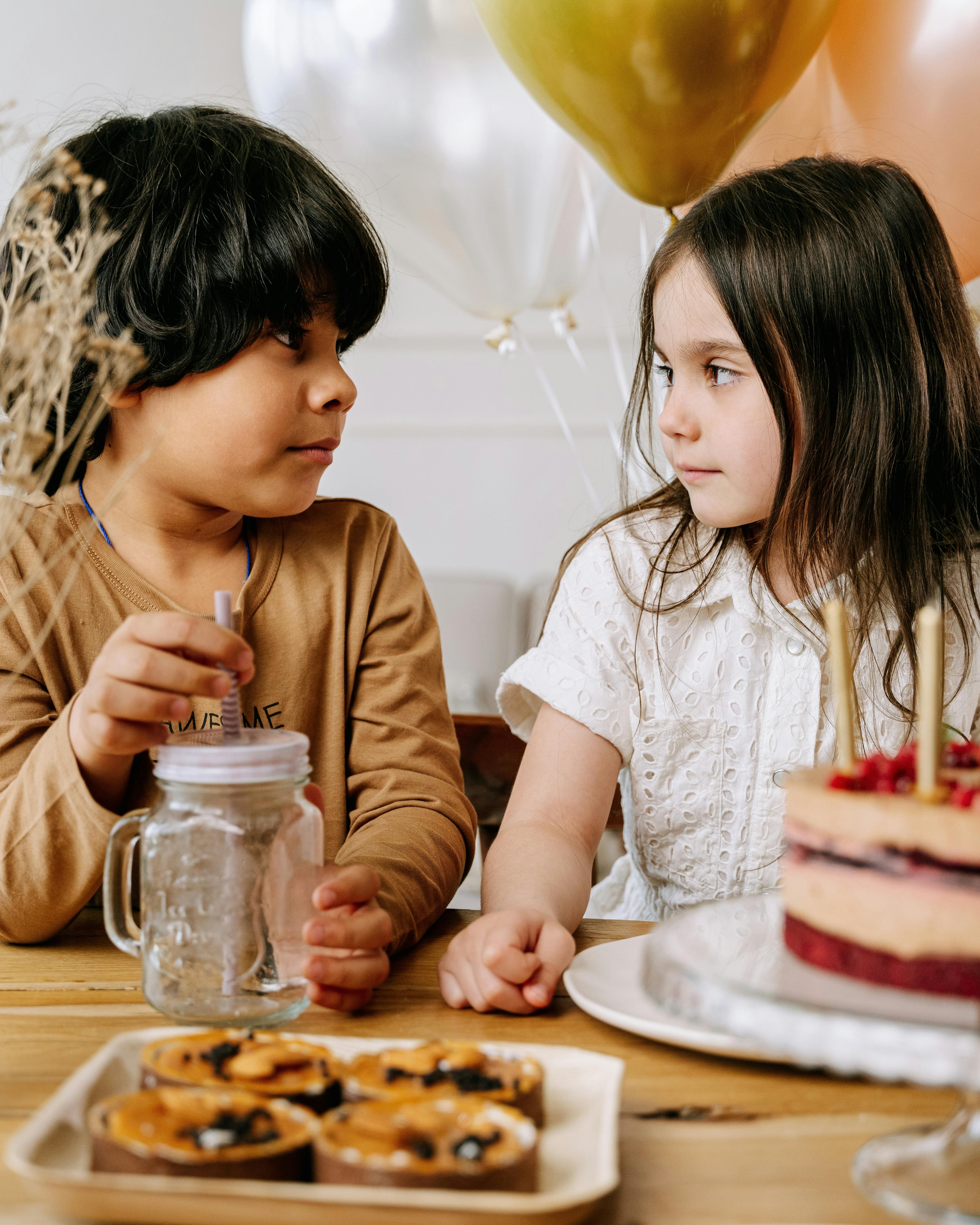 Two Kids At A Birthday Party