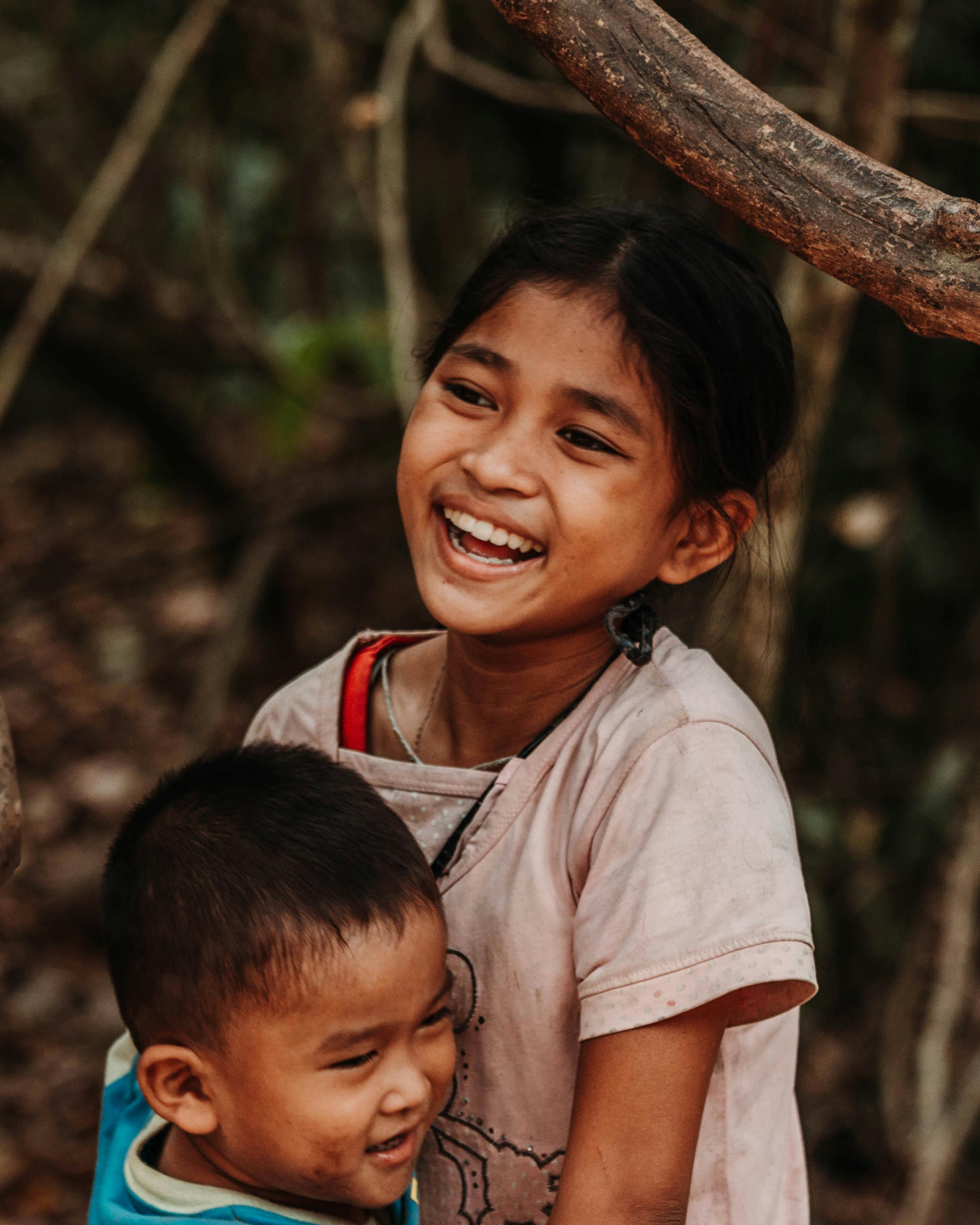 Two Smiling Children Outdoors