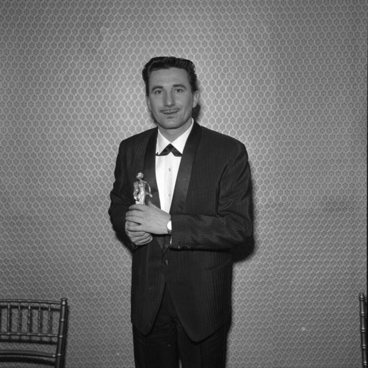 Man Holding Award Trophy
