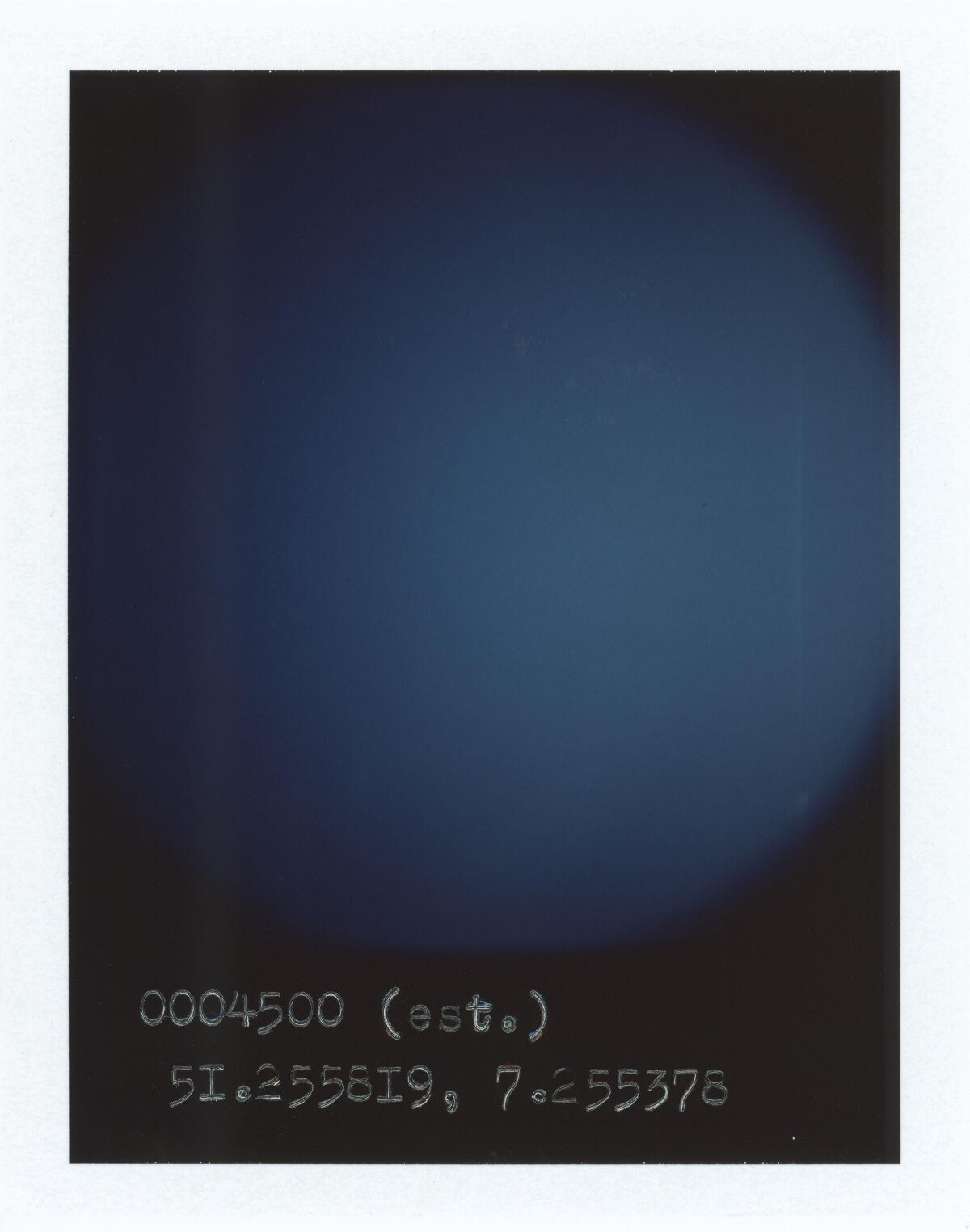 Polaroid With Handwritten Coordinates