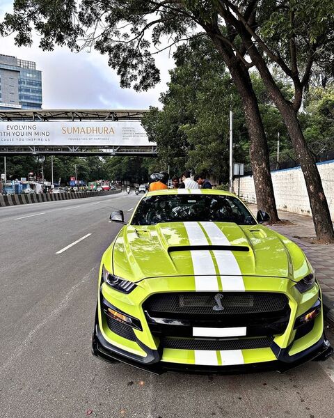 Bright Green Shelby Mustang on Urban Road