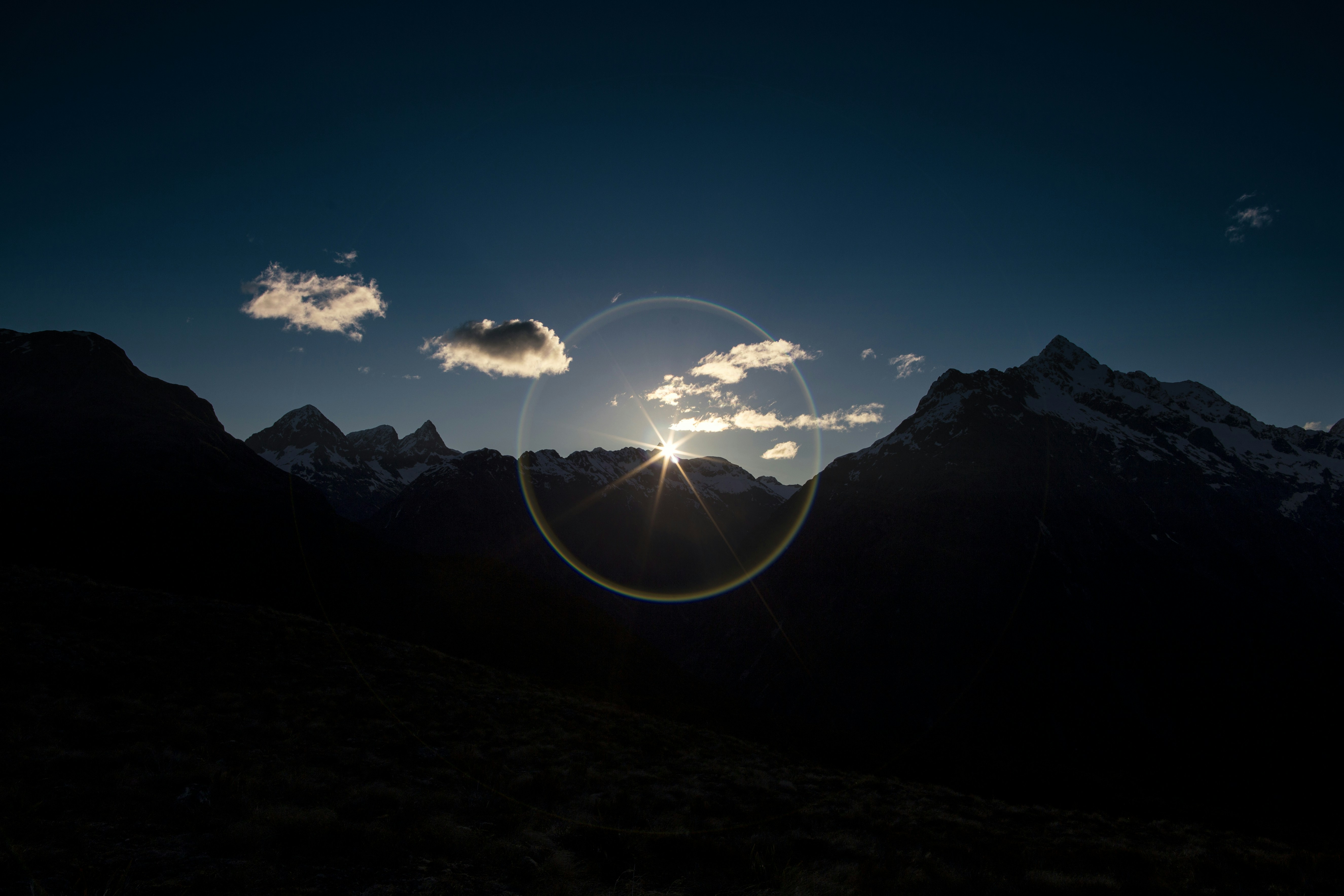 Sun Rising Over Mountain Peaks