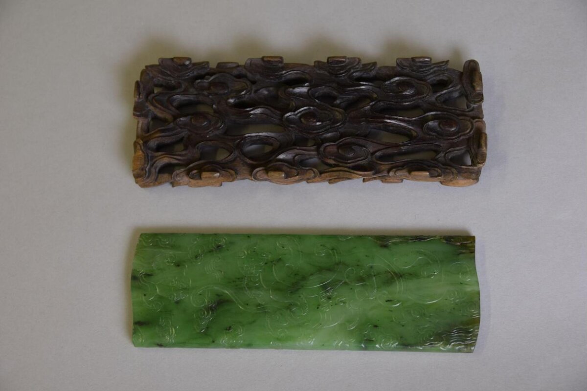 Jade armrest with carved wooden base