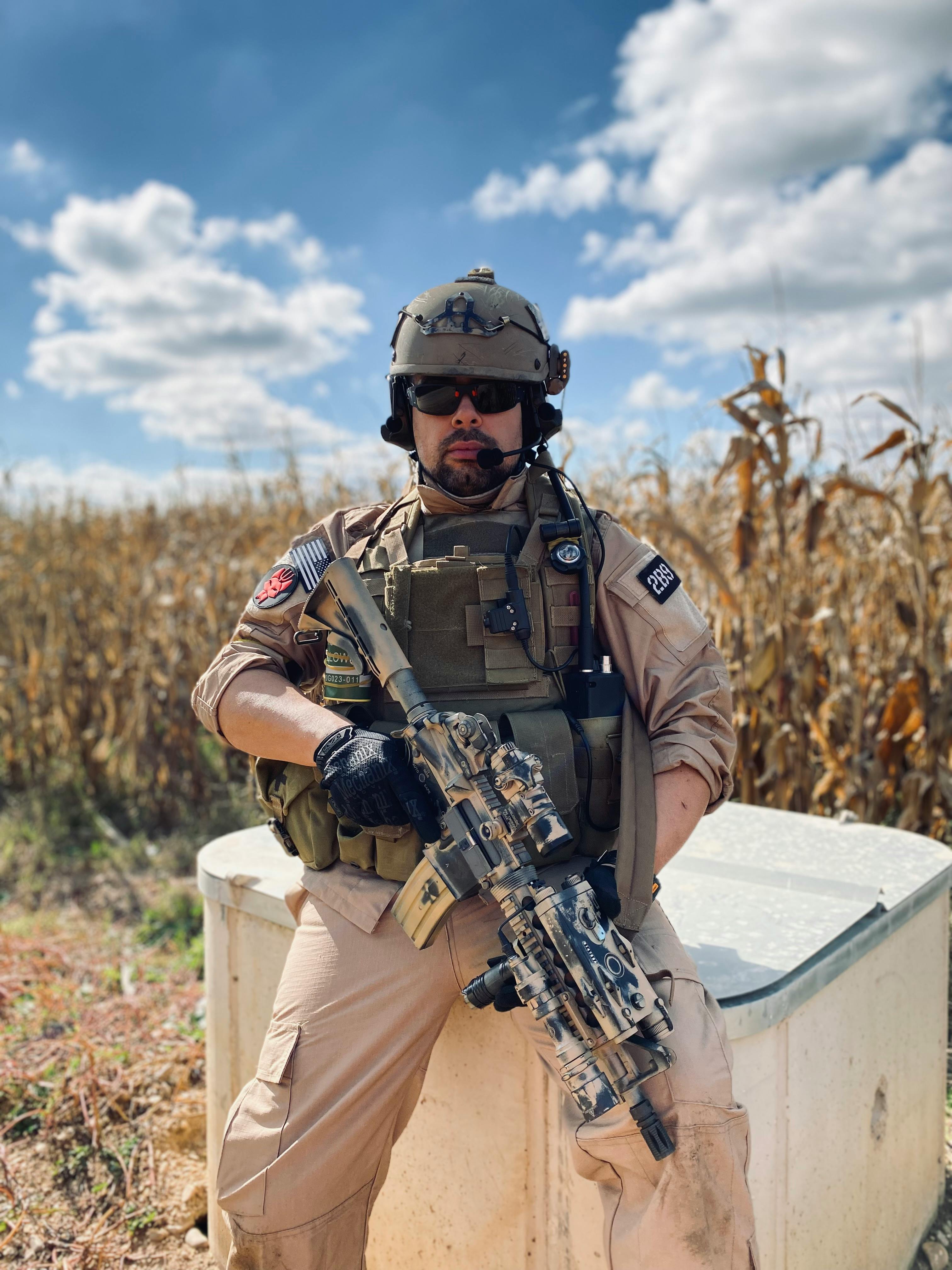 Tactical Airsoft Player in Dry Cornfield