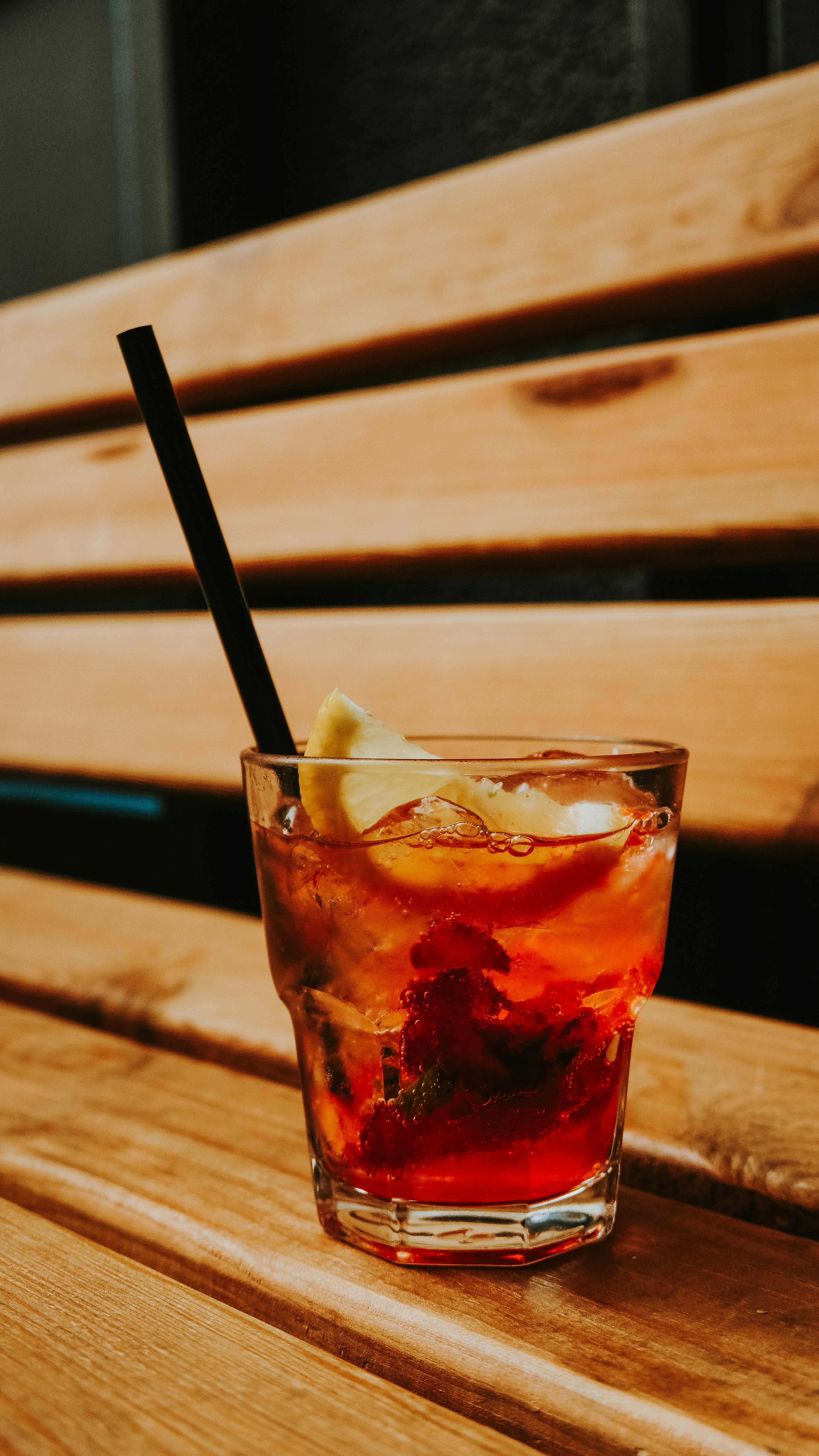 Iced Red Cocktail on Wooden Bench