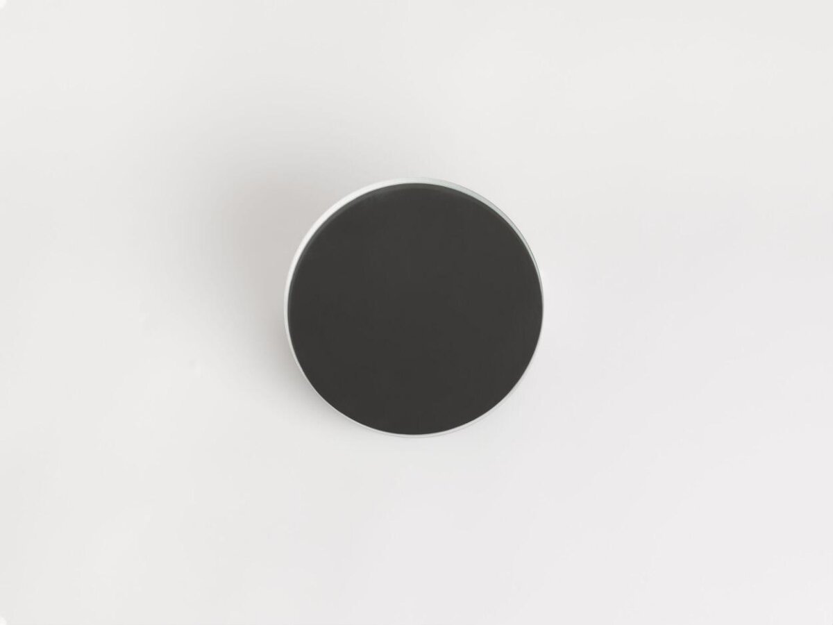 Black Circular Object on White Background