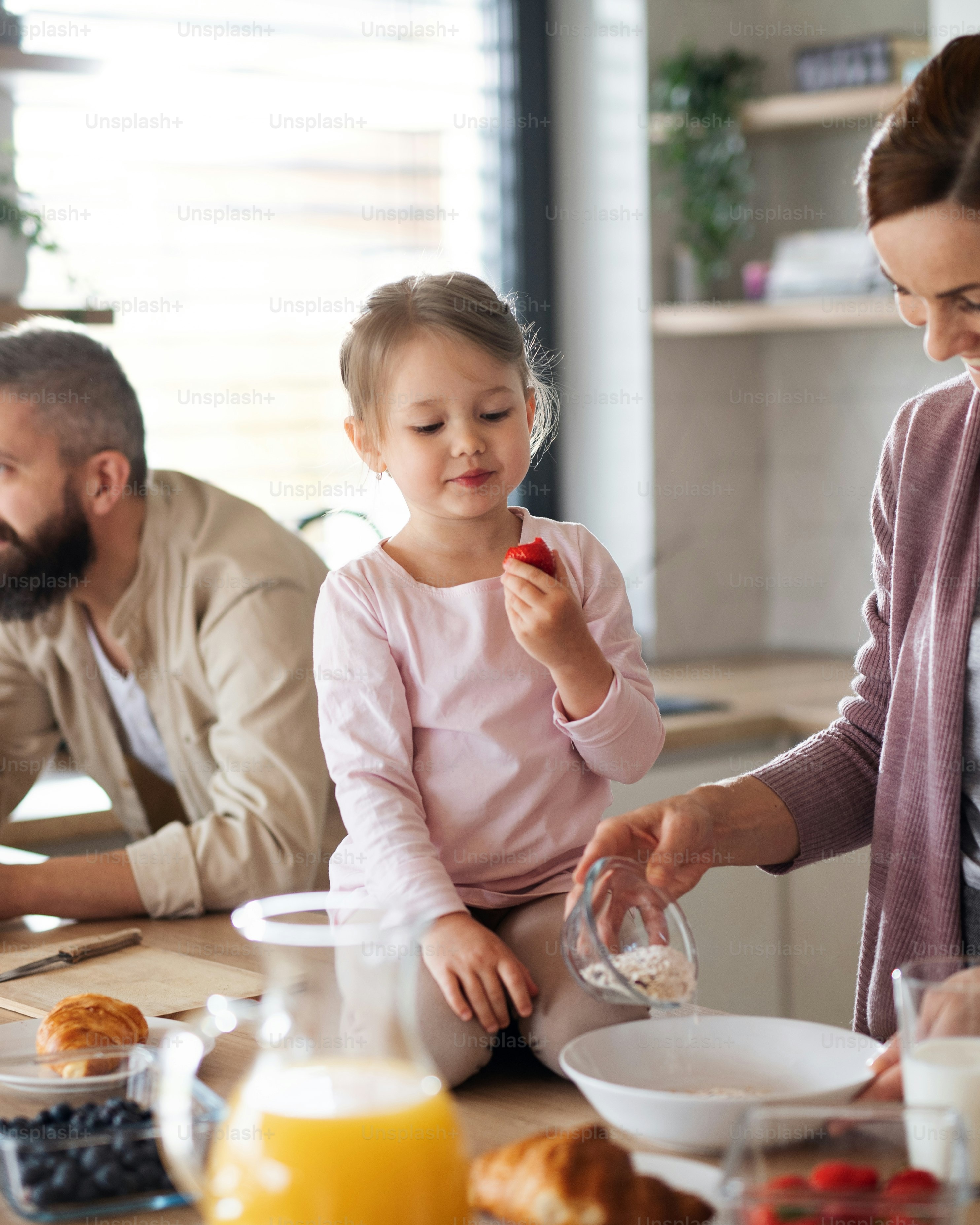 Family Having Breakfast at Home