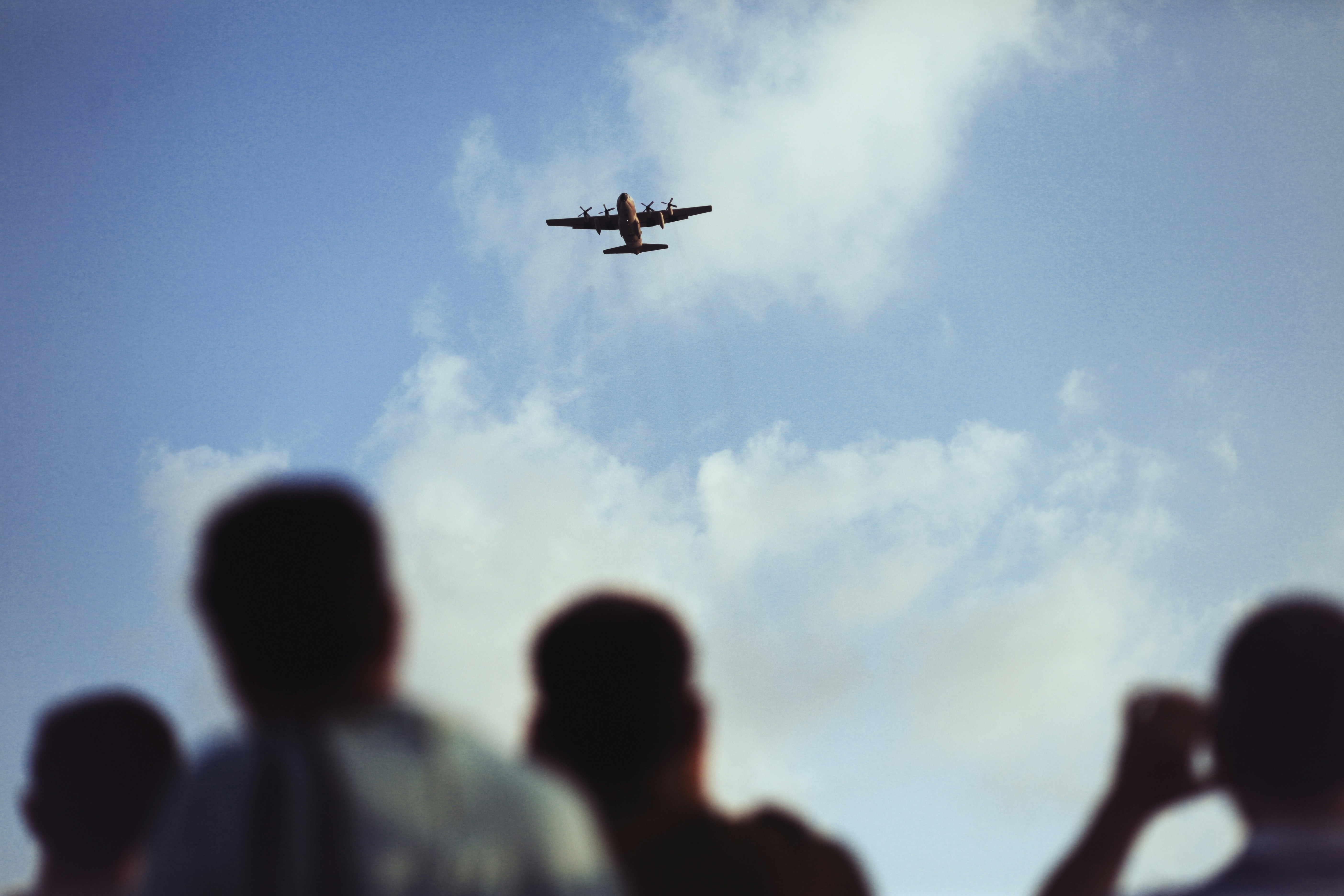 Crowd Watching Plane Fly Overhead