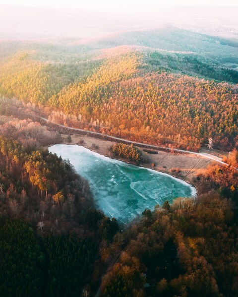 Frozen Lake in Autumn Forest Hills