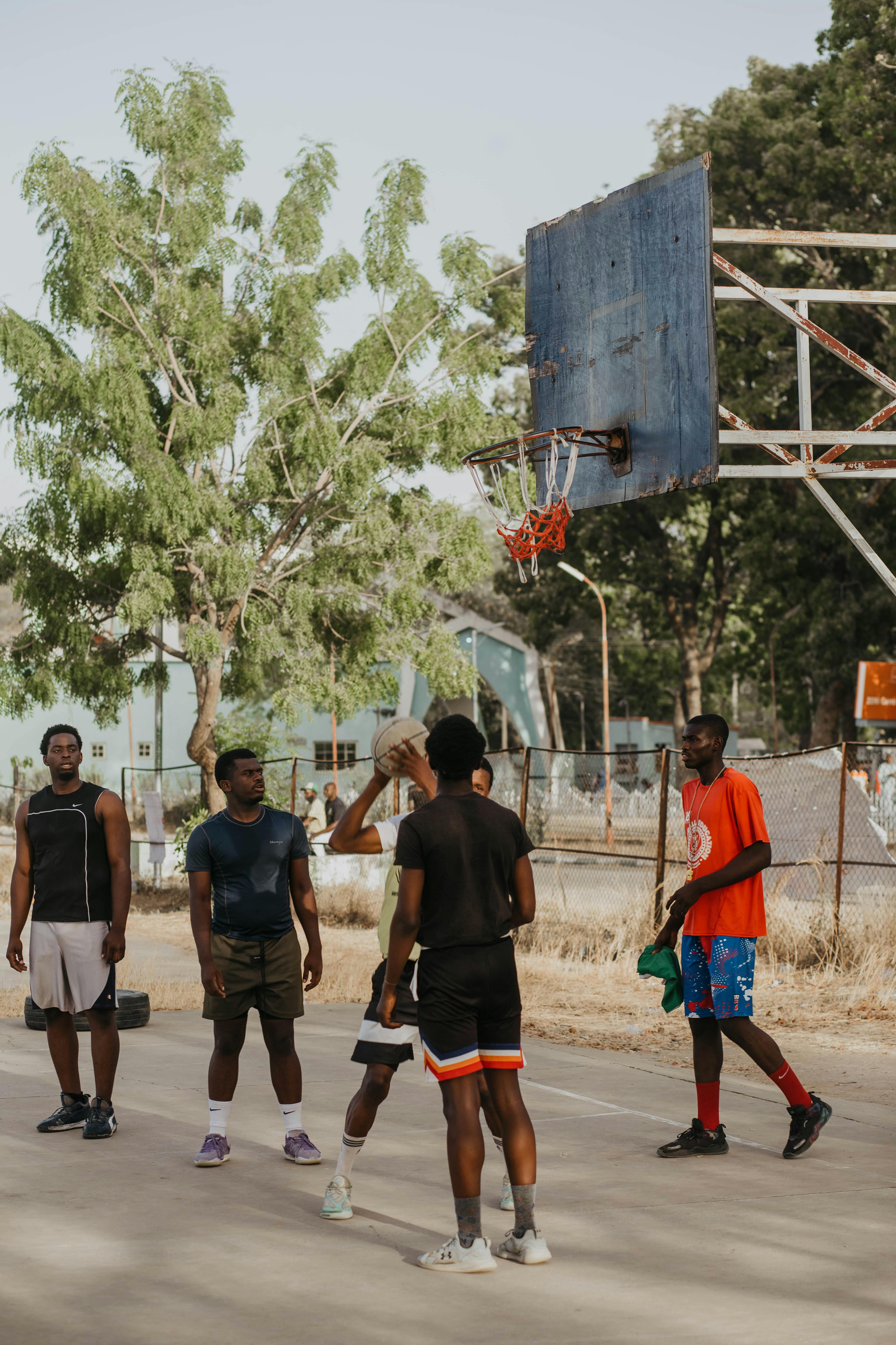 Group of Men Playing Outdoor Basketball
