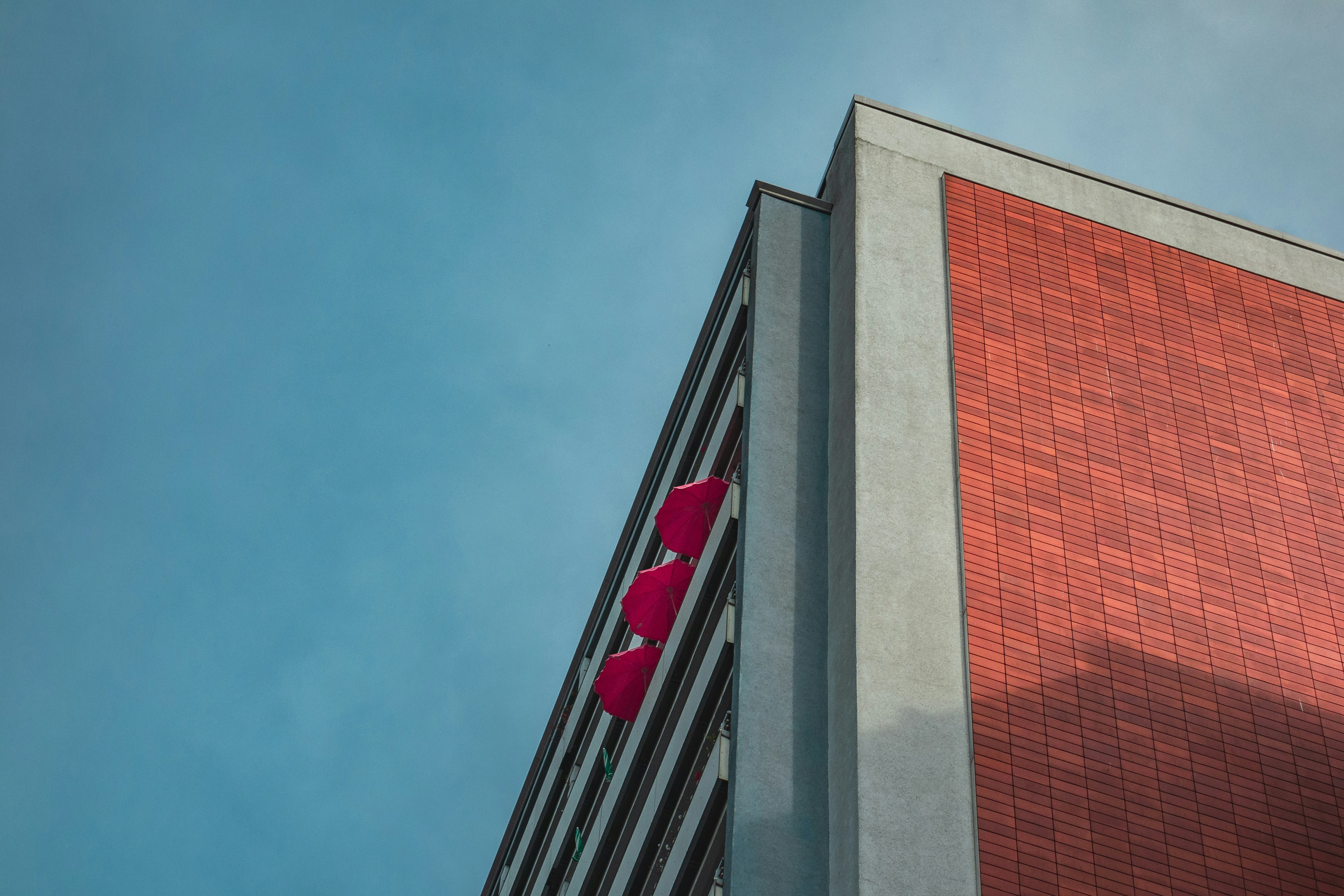 Modern Building with Red Umbrellas