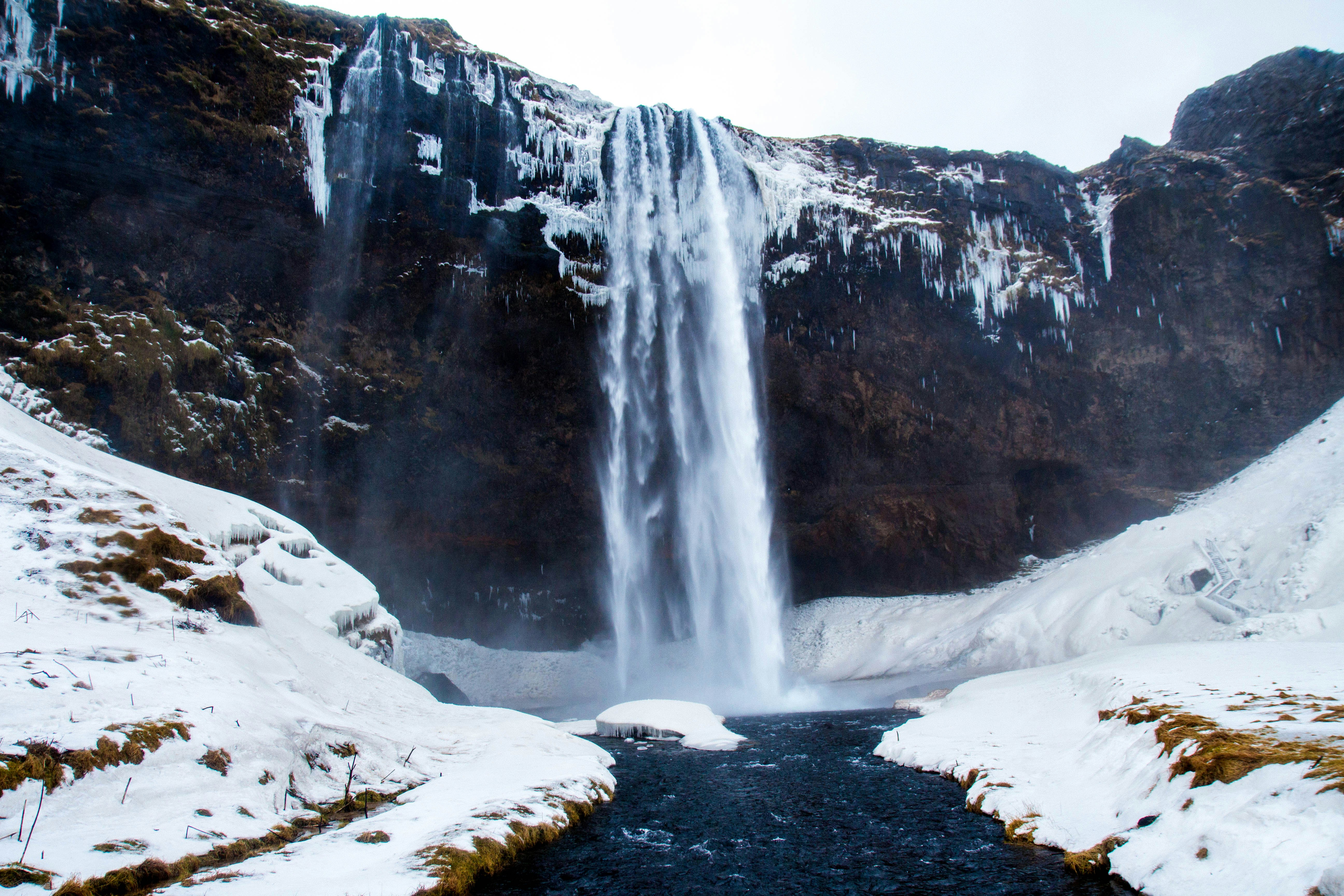 Winter Snowy Cliffside Waterfall