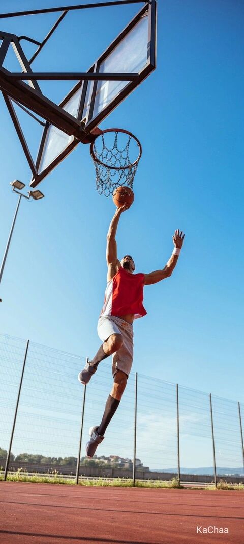 Basketball Player Shooting On Outdoor Court