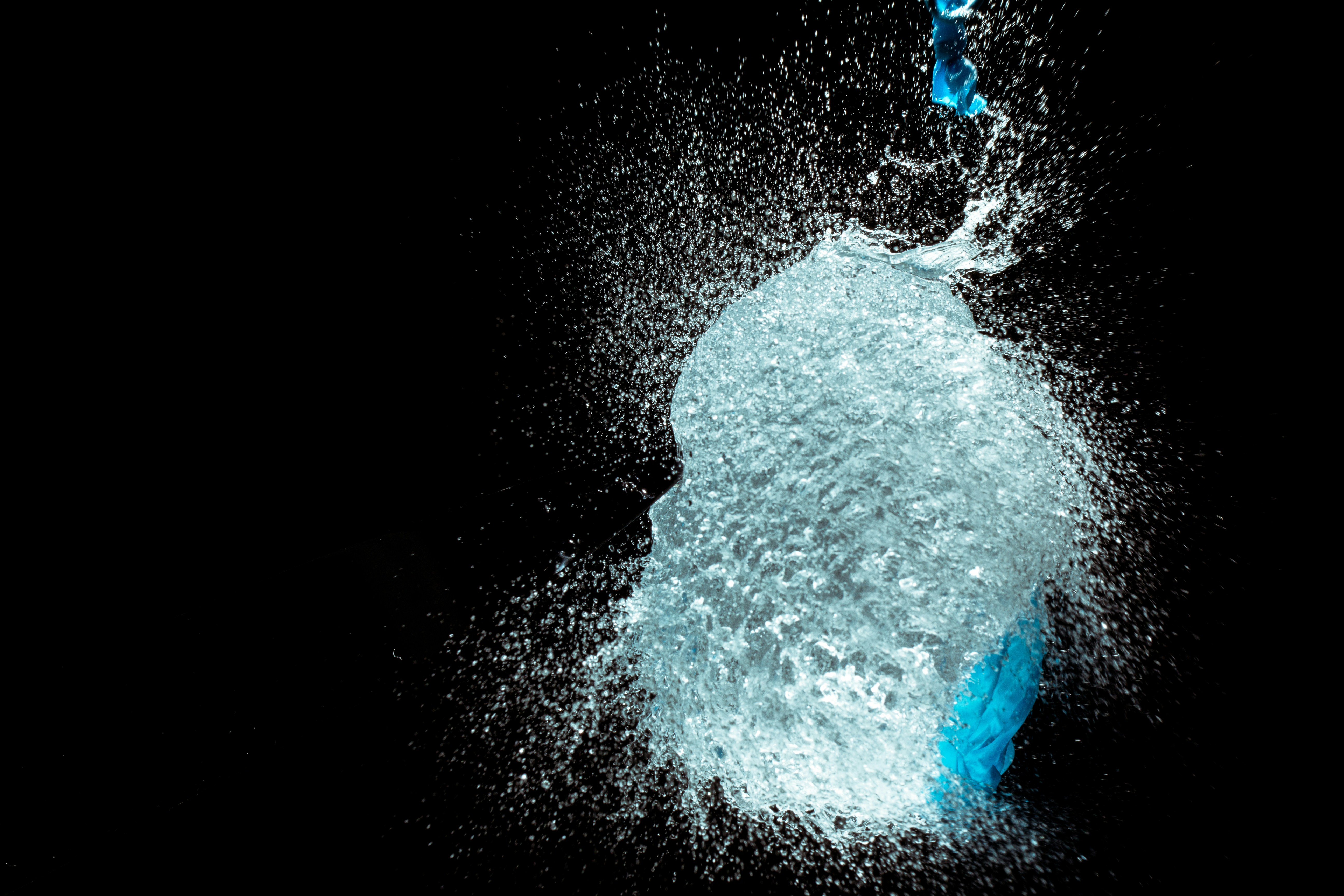 Water Splash Against Black Background