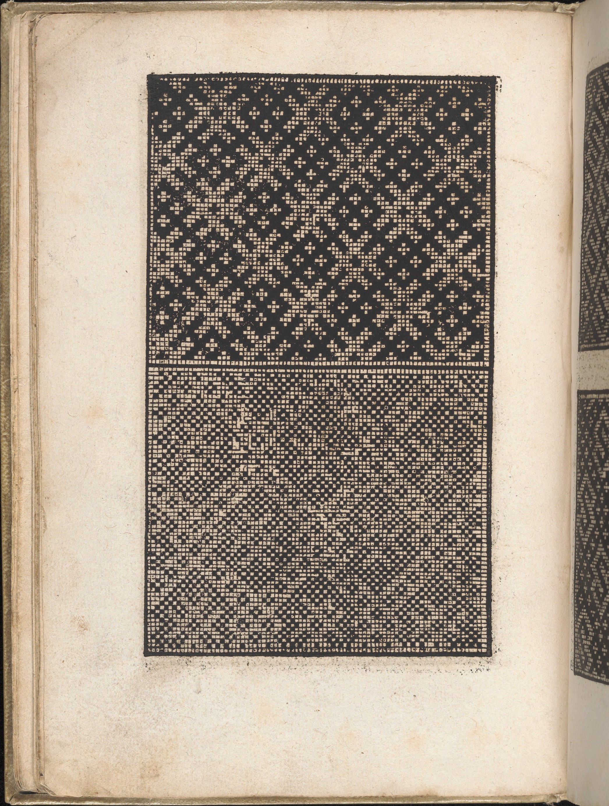 Two Black Geometric Patterns on Old Book Page