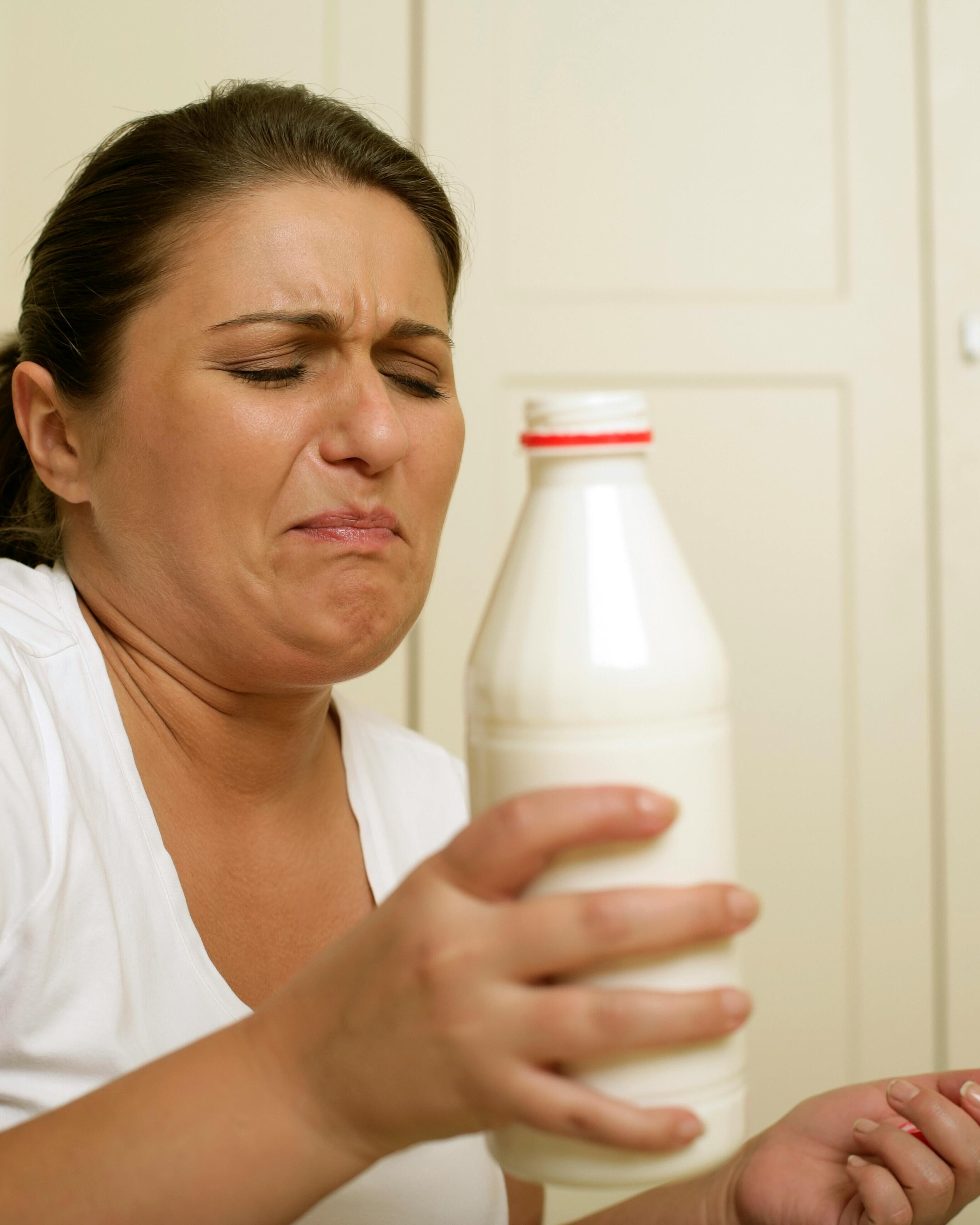 Woman Disgusted by Spoiled Milk