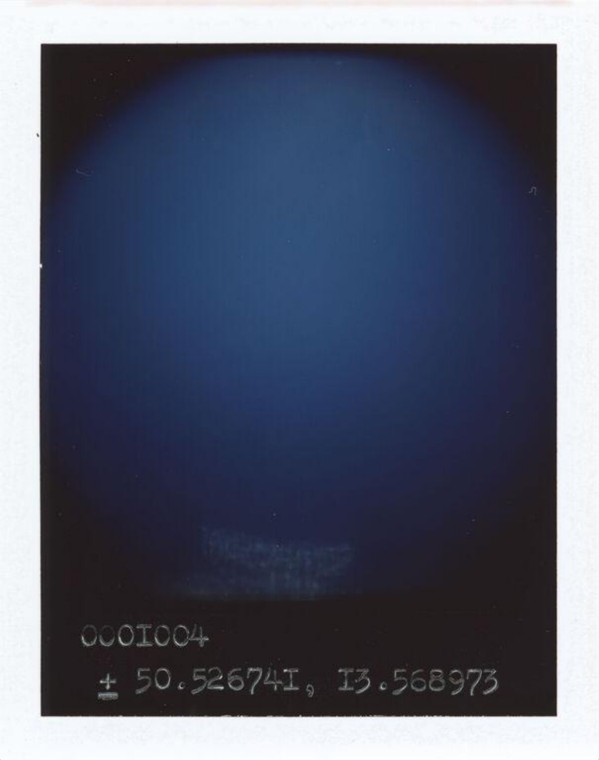 Blue Polaroid with Geographic Coordinates