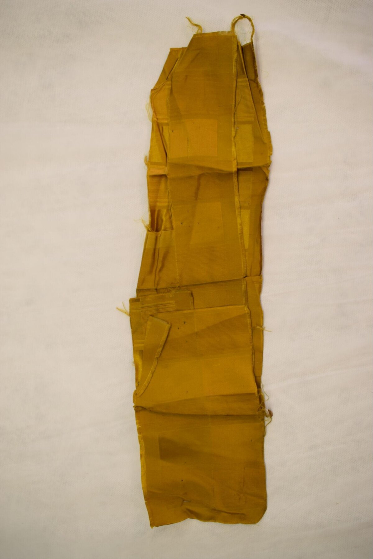 Folded Yellow Silk Fabric Fragment