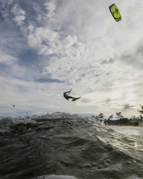 Airborne Kitesurfer Over Ocean